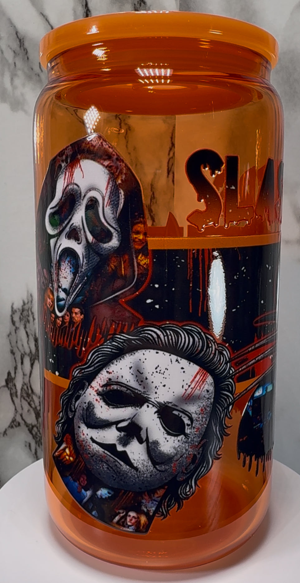Slashers UVDTF on a orange beer can glass