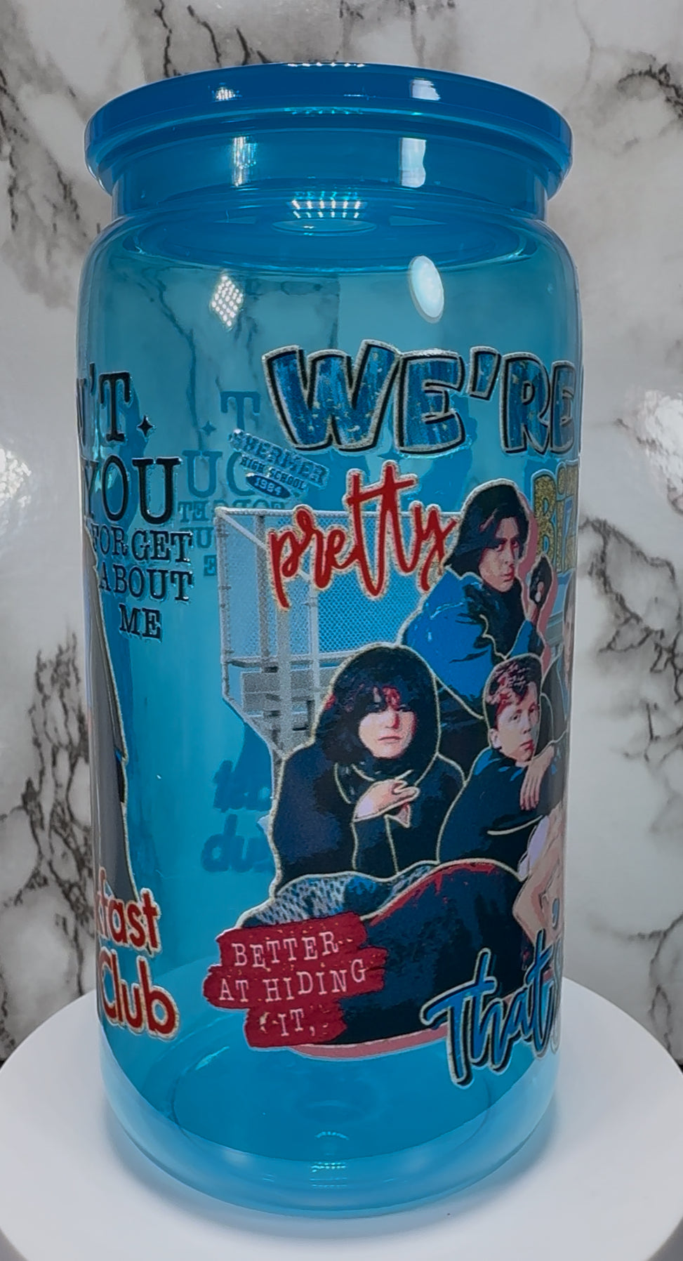 Breakfast Club UVDTF on a bright blue PLASTIC beer can cup