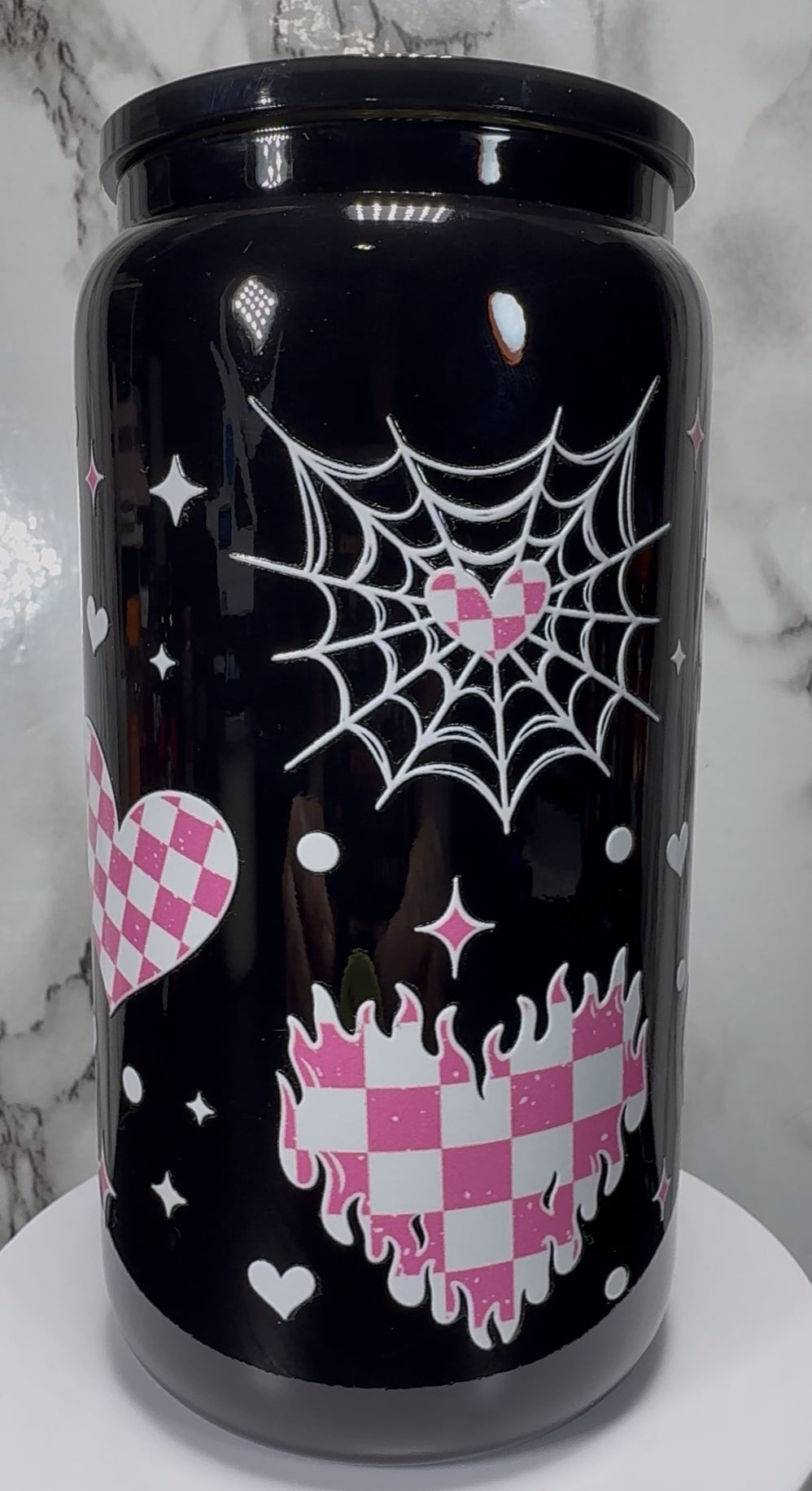 White & Pink Checkered Hearts UVDTF on a black beer can glass