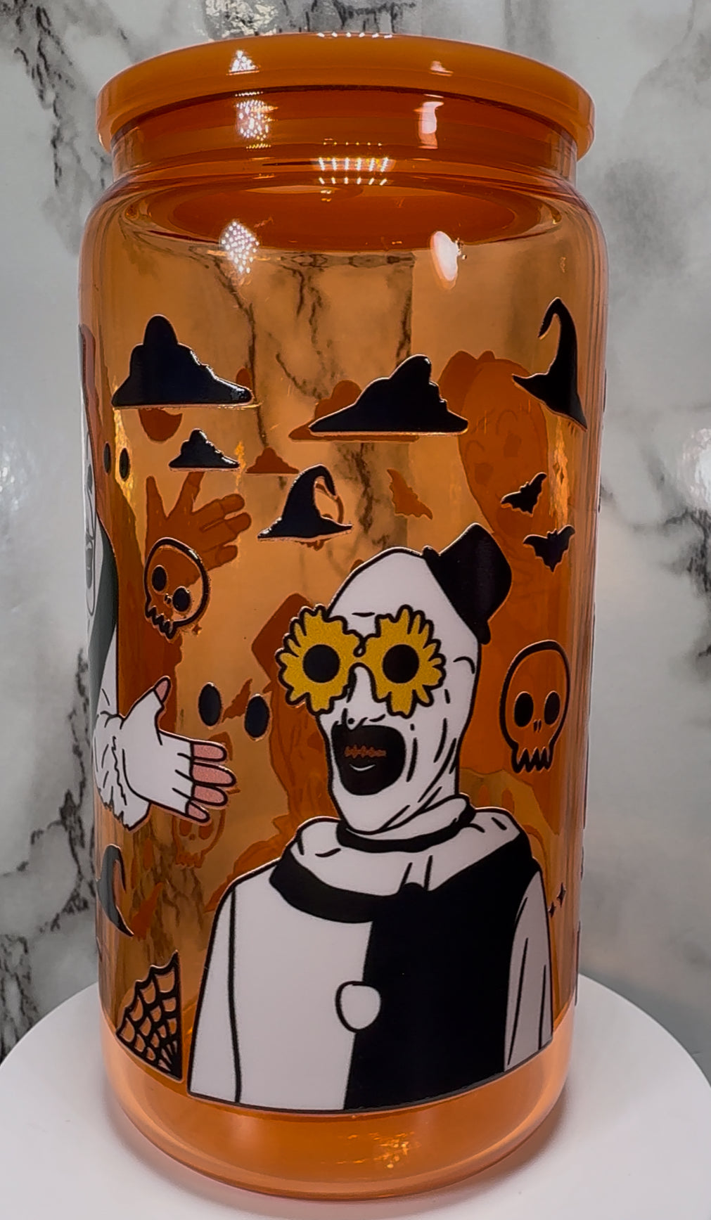 Art Terrifier UVDTF on a orange beer can glass