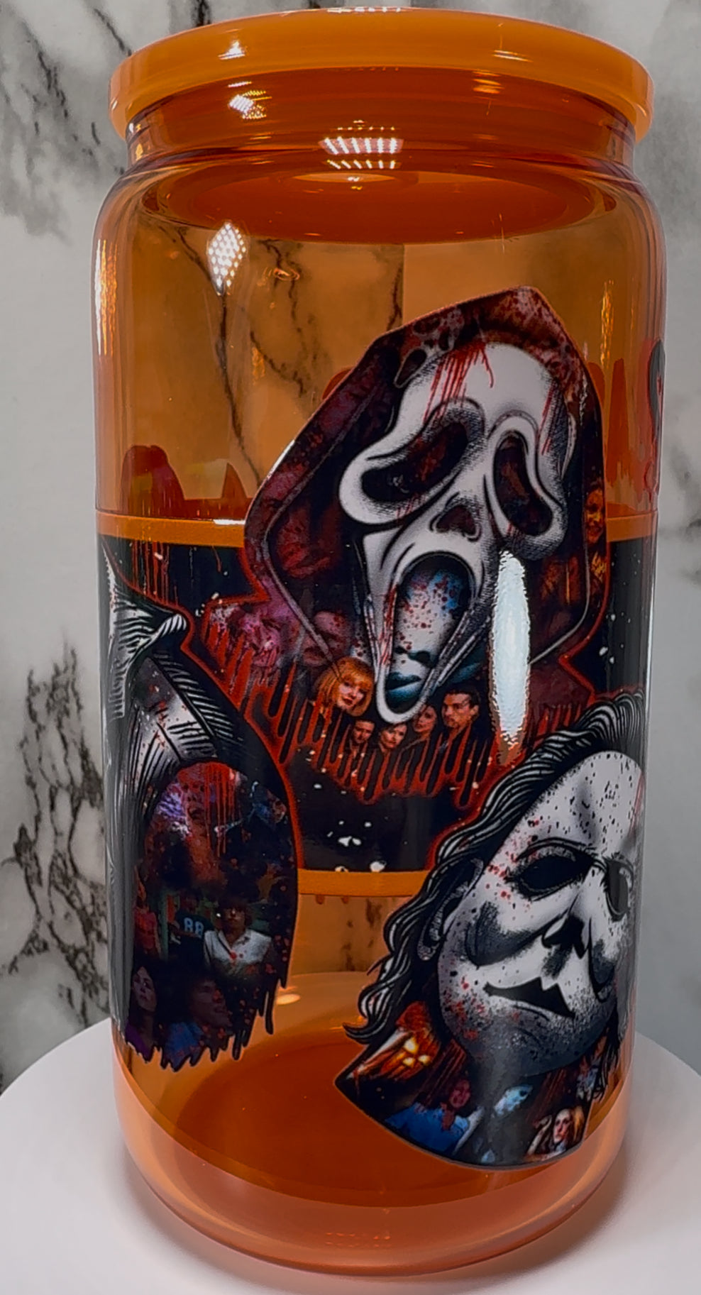 Slashers UVDTF on a orange beer can glass