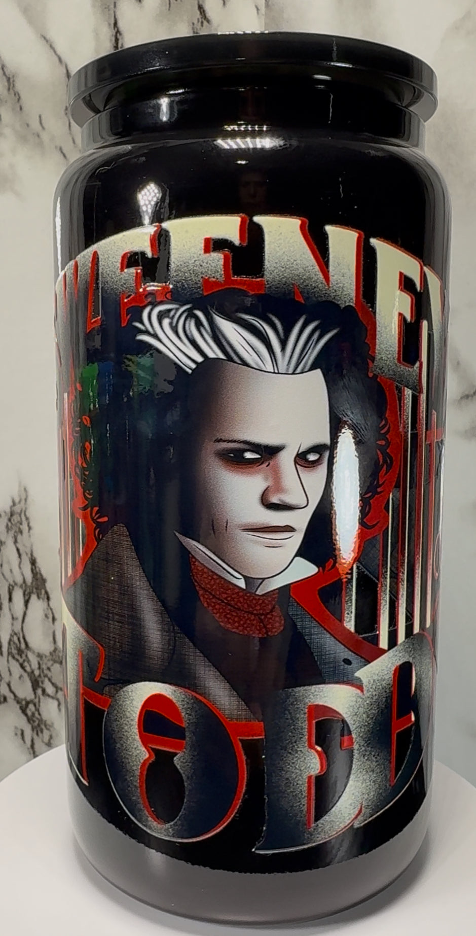 Sweeney Todd UVDTF on a black beer can glass