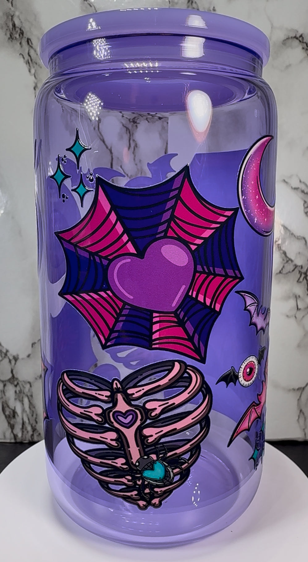Elvira UVDTF on a purple beer can glass