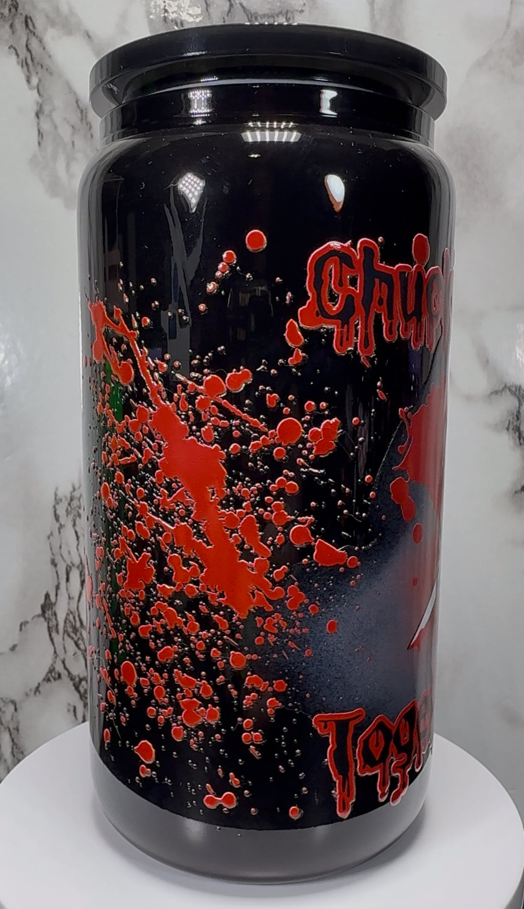 Chucky & Tiffany UVDTF on a black beer can glass