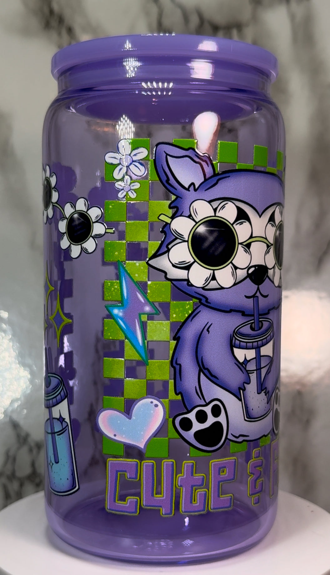 Cute & Feral Raccoon UVDTF on a purple beer can glass