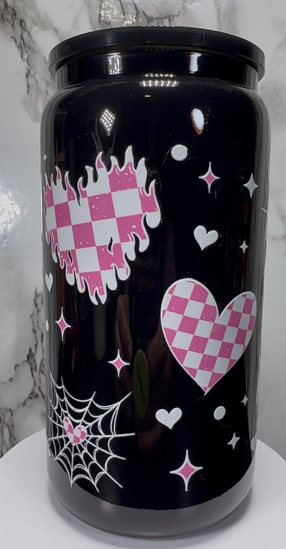 White & Pink Checkered Hearts UVDTF on a black beer can glass