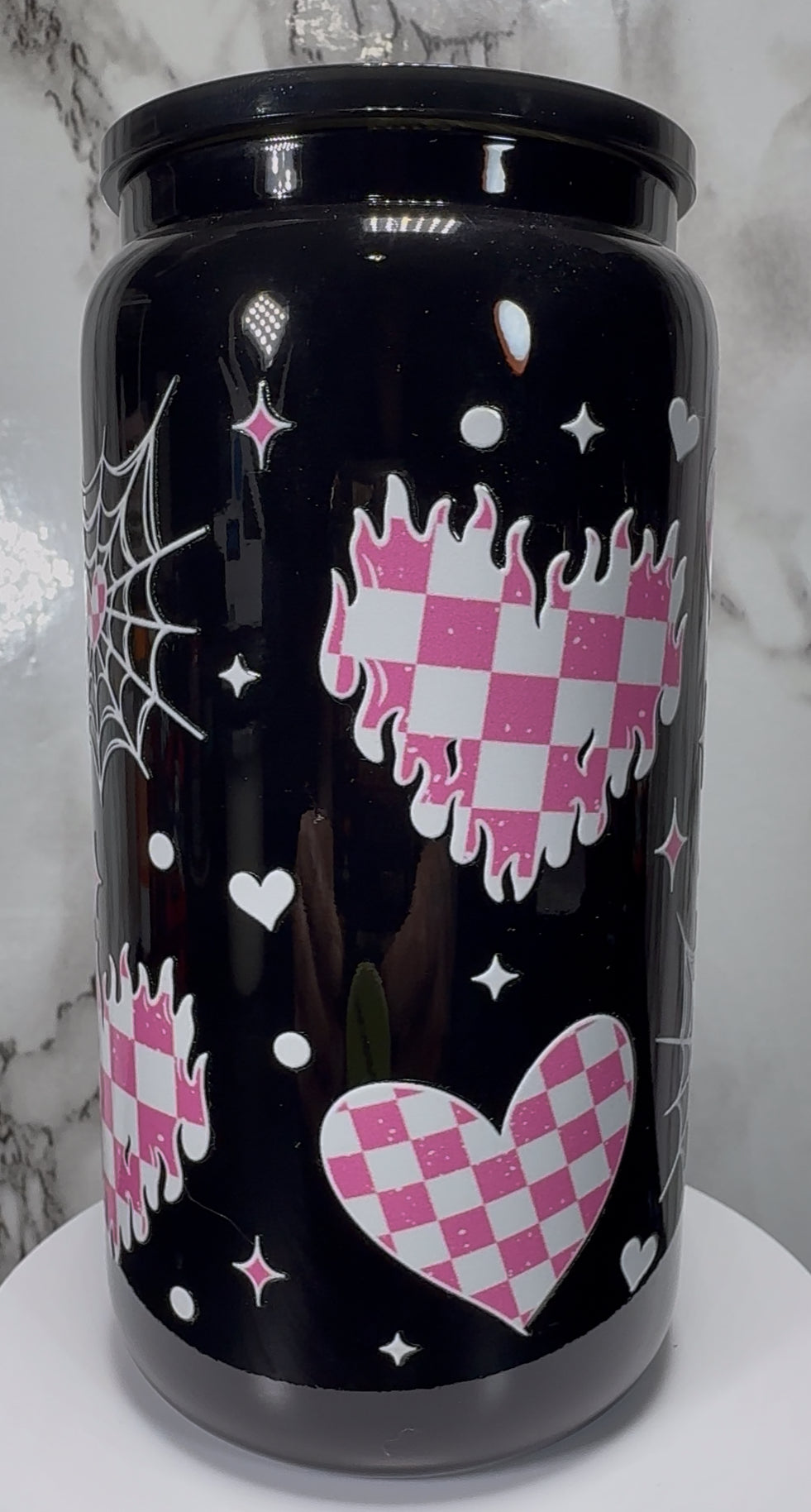 White & Pink Checkered Hearts UVDTF on a black beer can glass