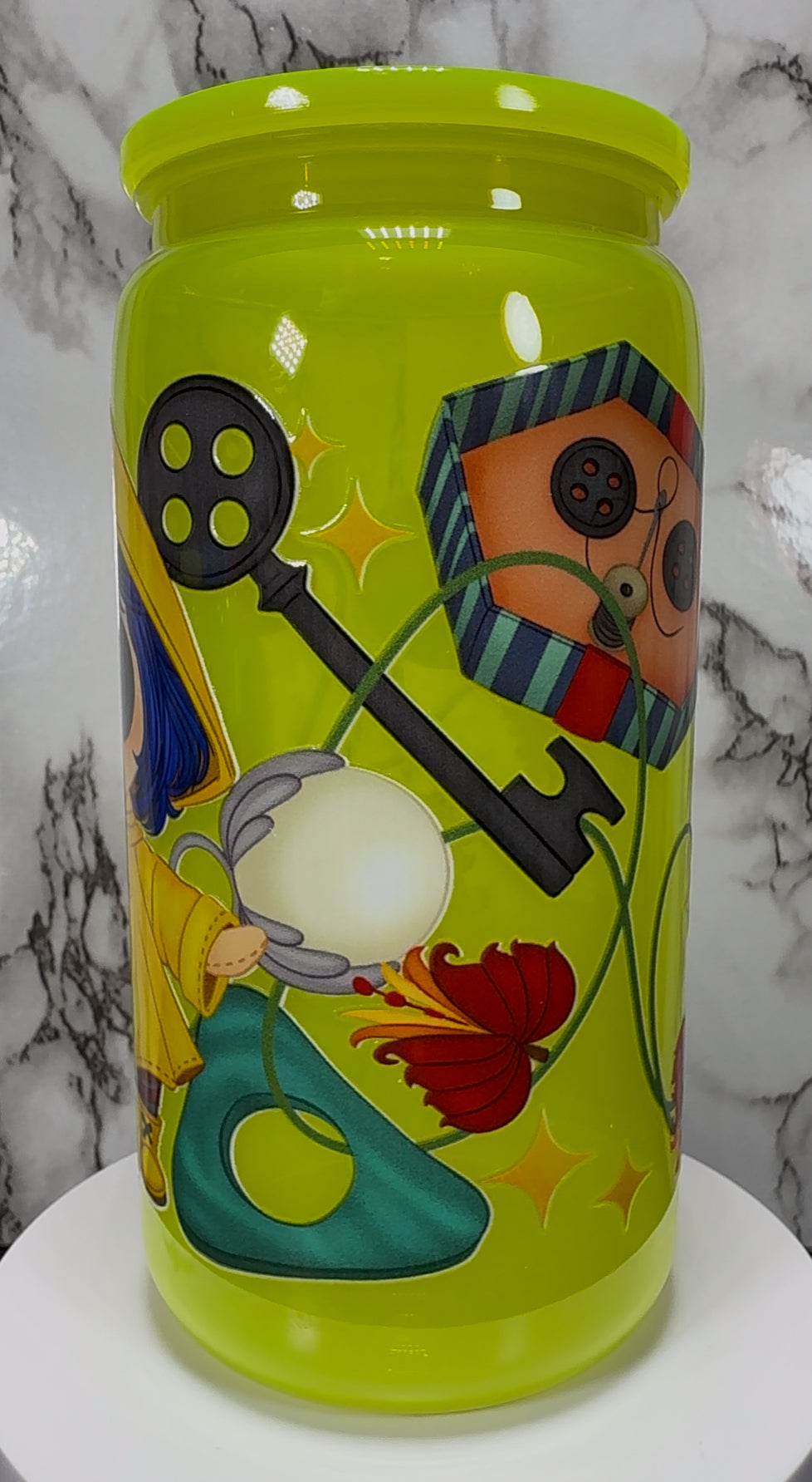 Little Coraline on a bright yellow PLASTIC beer can cup