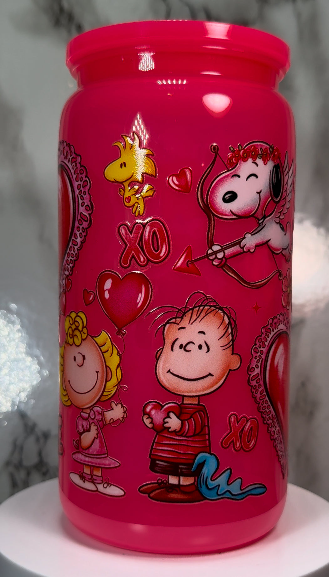 Charlie Brown Valentine’s Day UVDTF on a plastic hot pink beer can cup