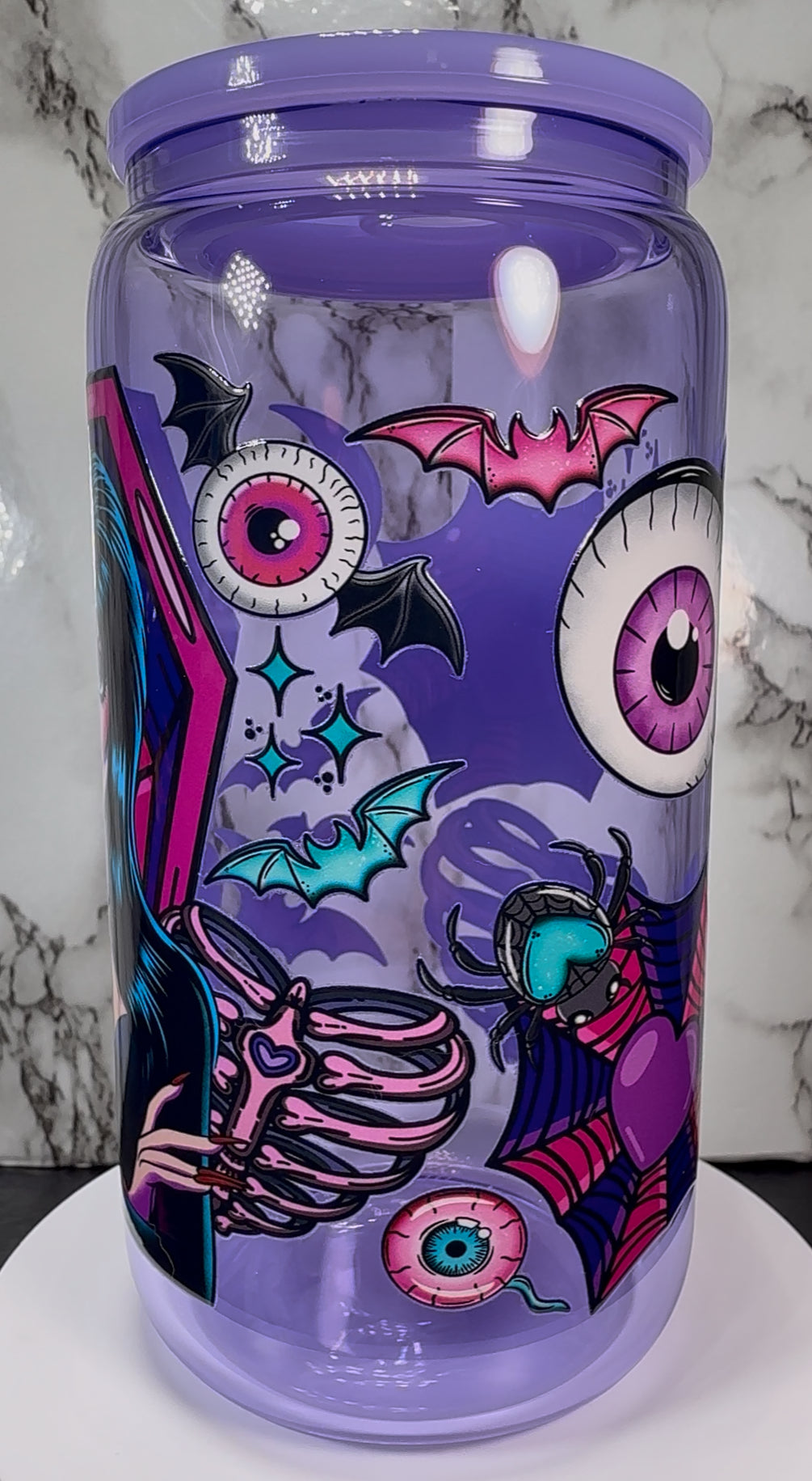 Elvira UVDTF on a purple beer can glass