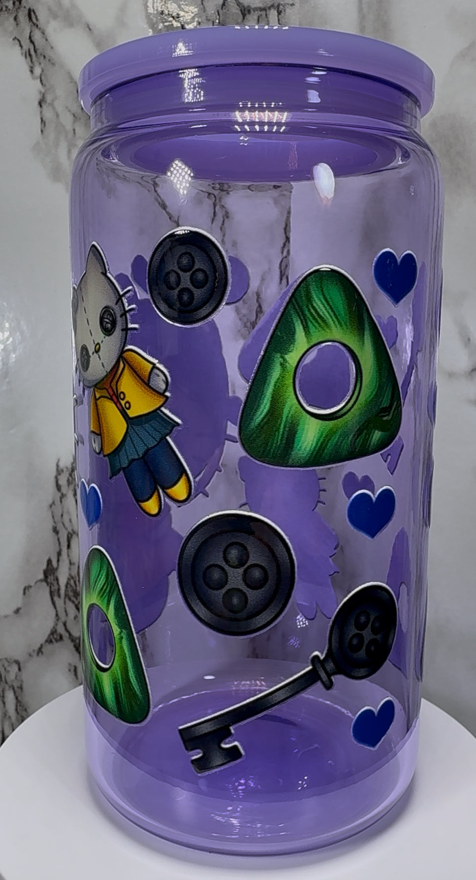 Coraline Hello Kitty UVDTF on a purple beer can glass
