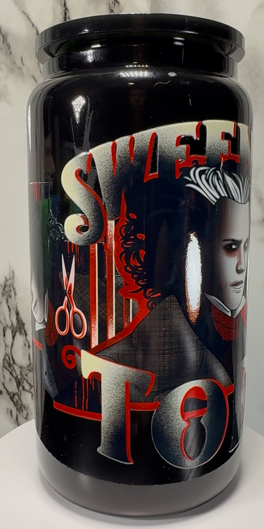 Sweeney Todd UVDTF on a black beer can glass