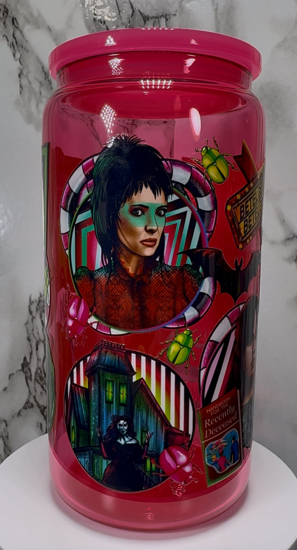 Beetlejuice UVDTF on a hot pink beer can glass