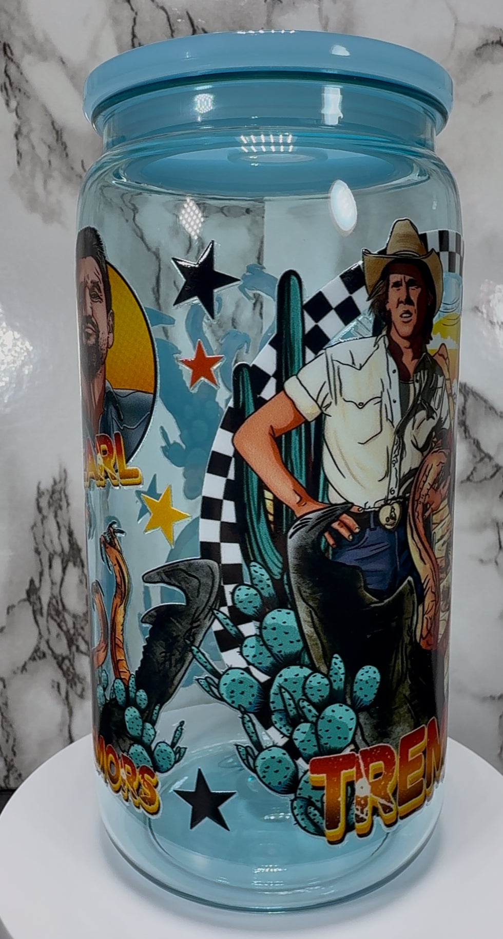 Tremors UVDTF on a light blue PLASTIC beer can cup