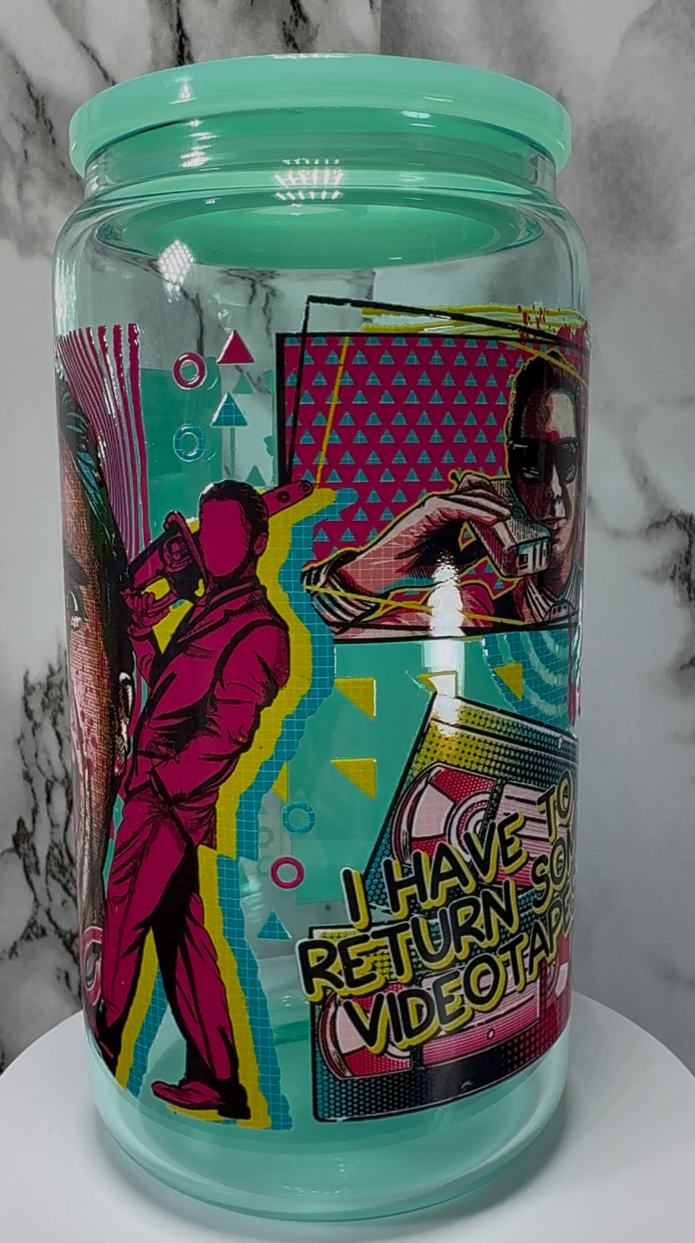 American Psycho Patrick Bateman UVDTF on a teal beer can glass