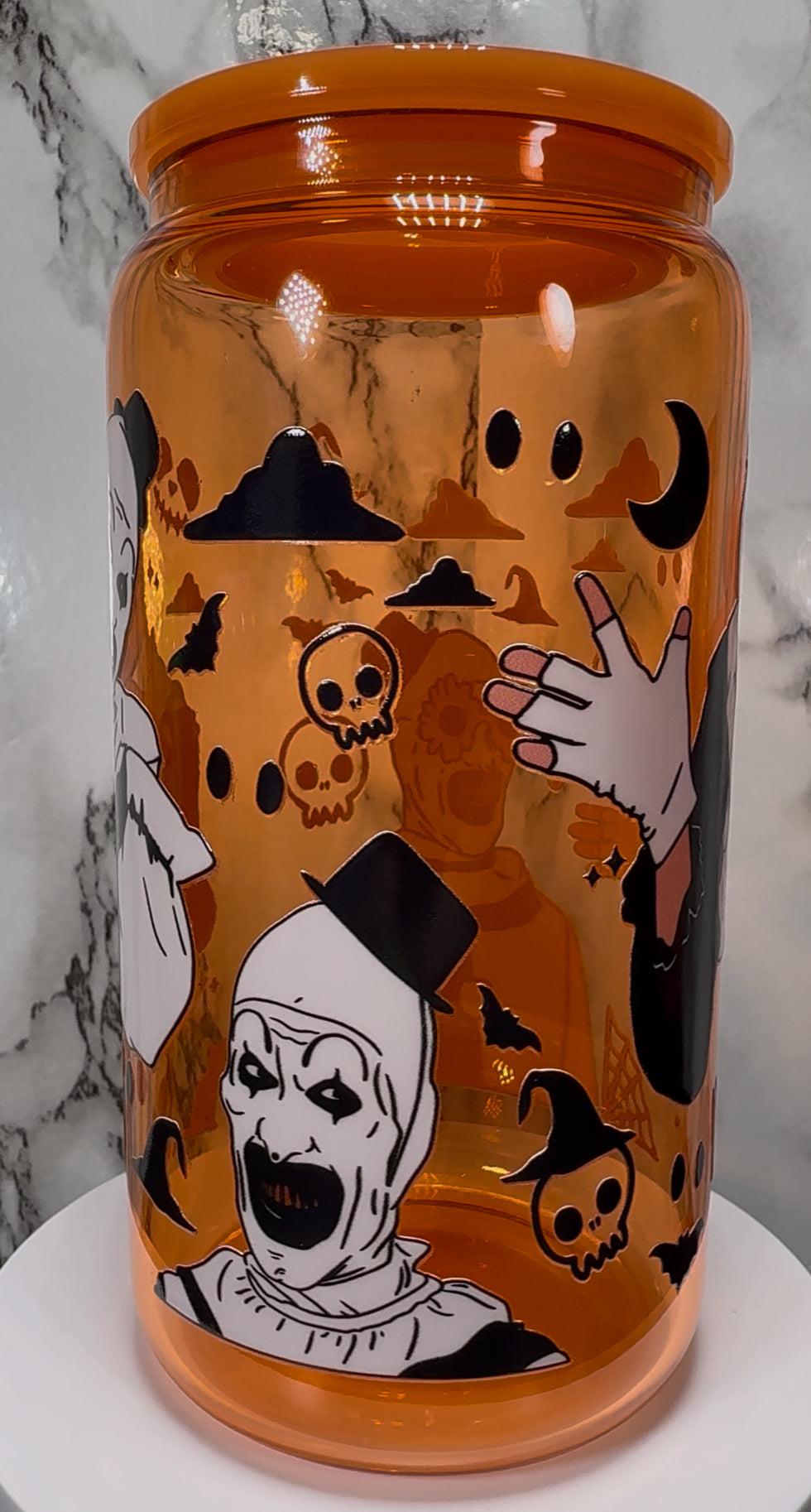 Art Terrifier UVDTF on a orange beer can glass