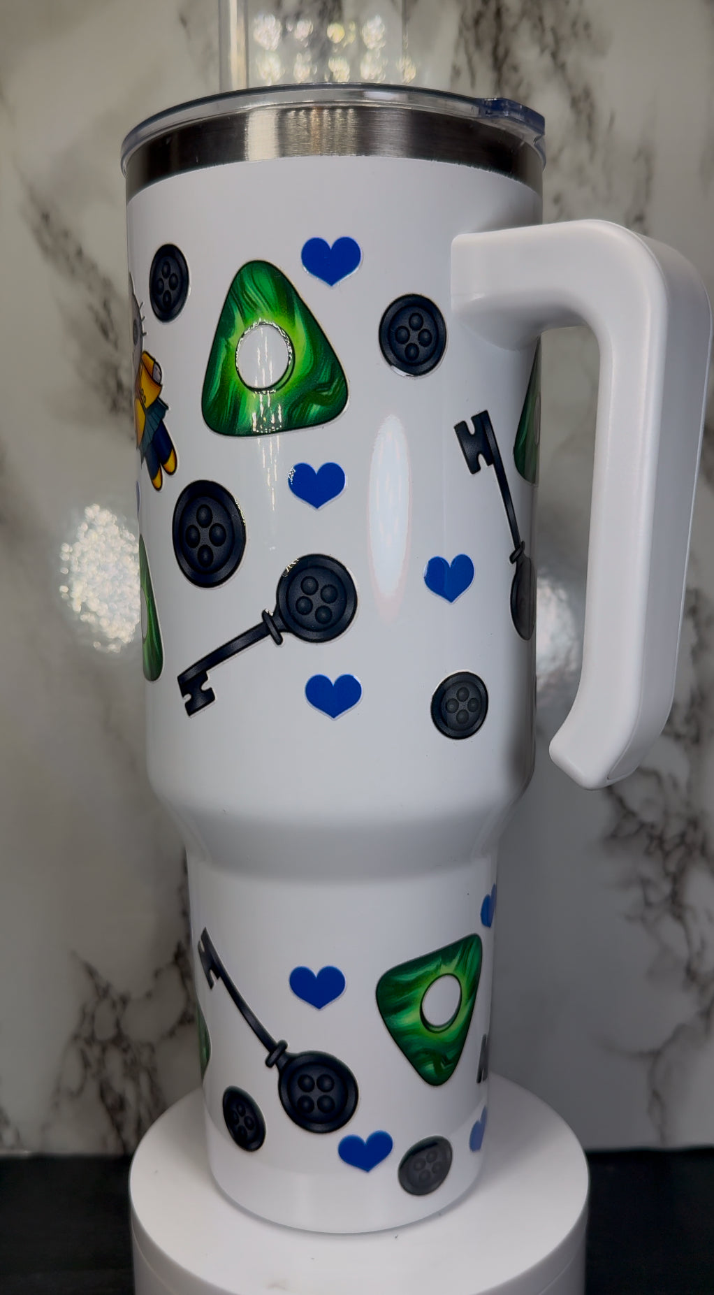 Hello Kitty Coraline UVDTF on a 40 oz white tumbler