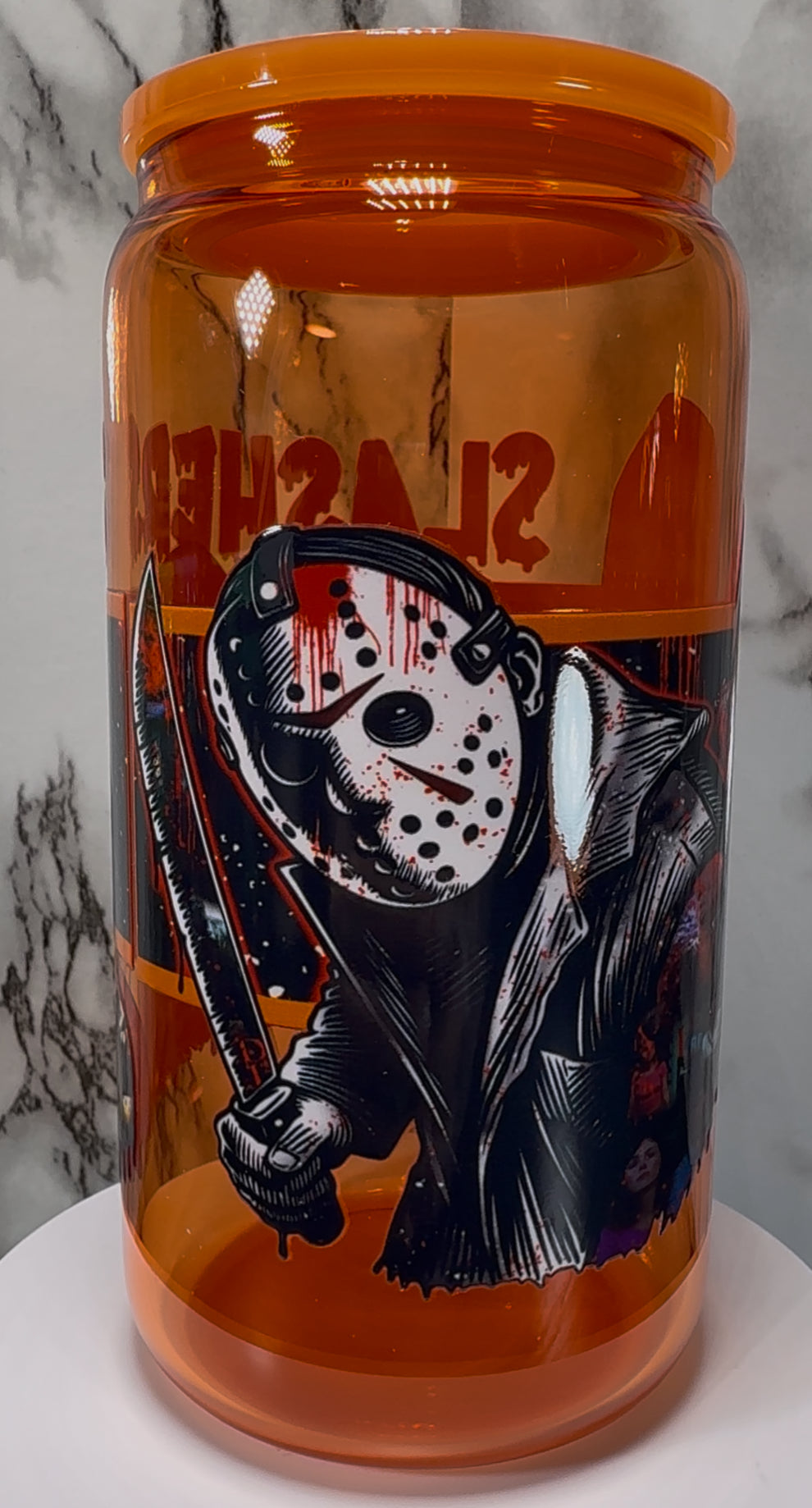 Slashers UVDTF on a orange beer can glass