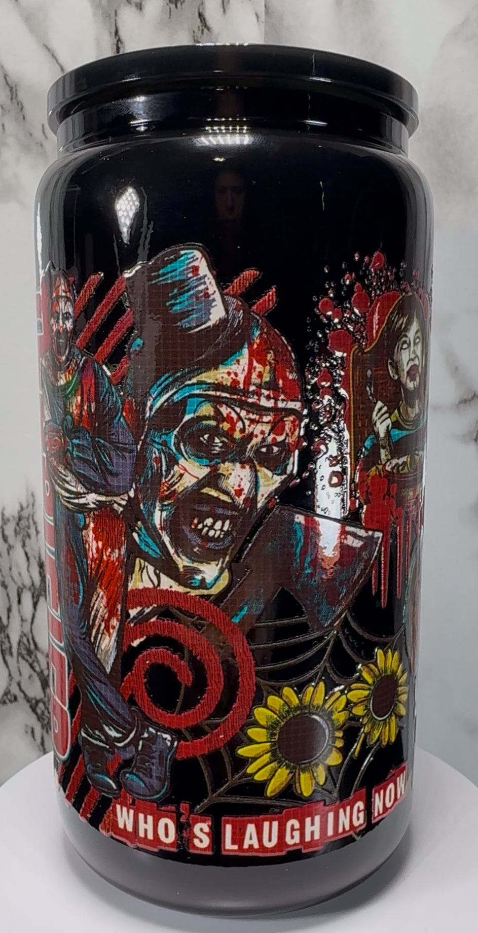 Terrifier Art The Clown UVDTF on a black beer can glass