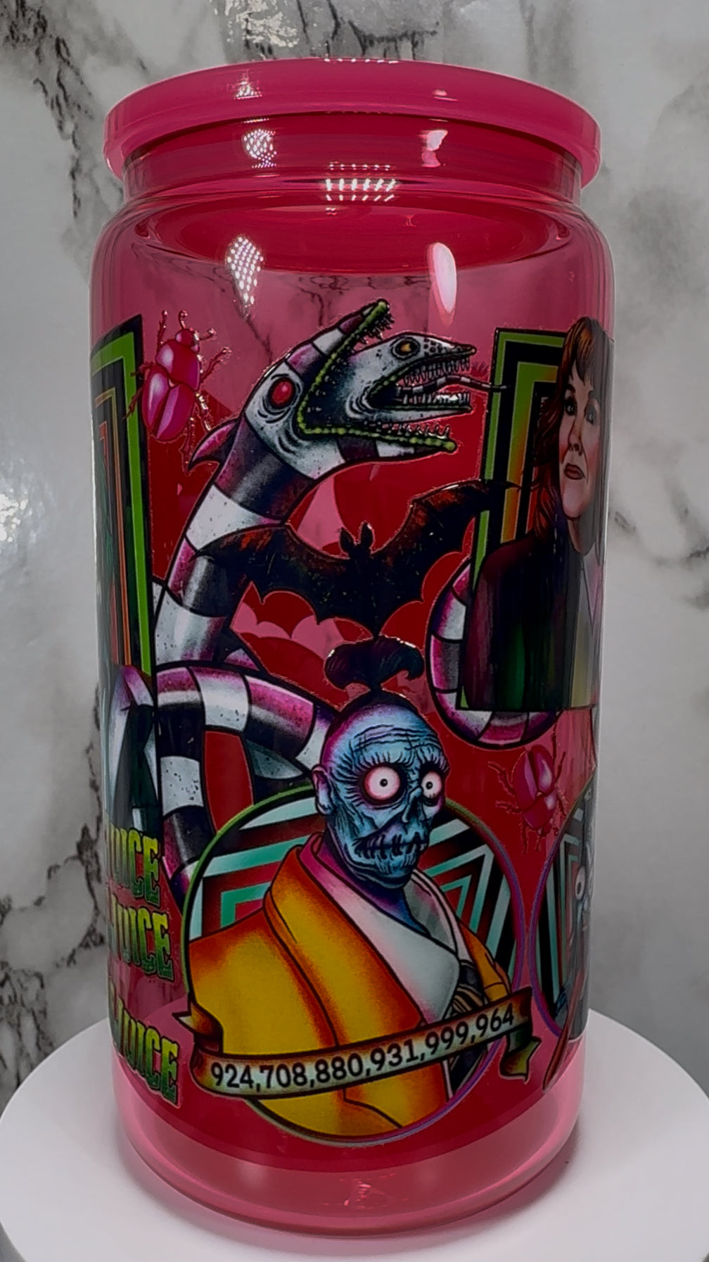 Beetlejuice UVDTF on a hot pink beer can glass