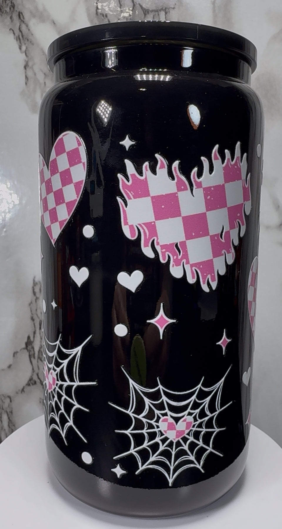 White & Pink Checkered Hearts UVDTF on a black beer can glass