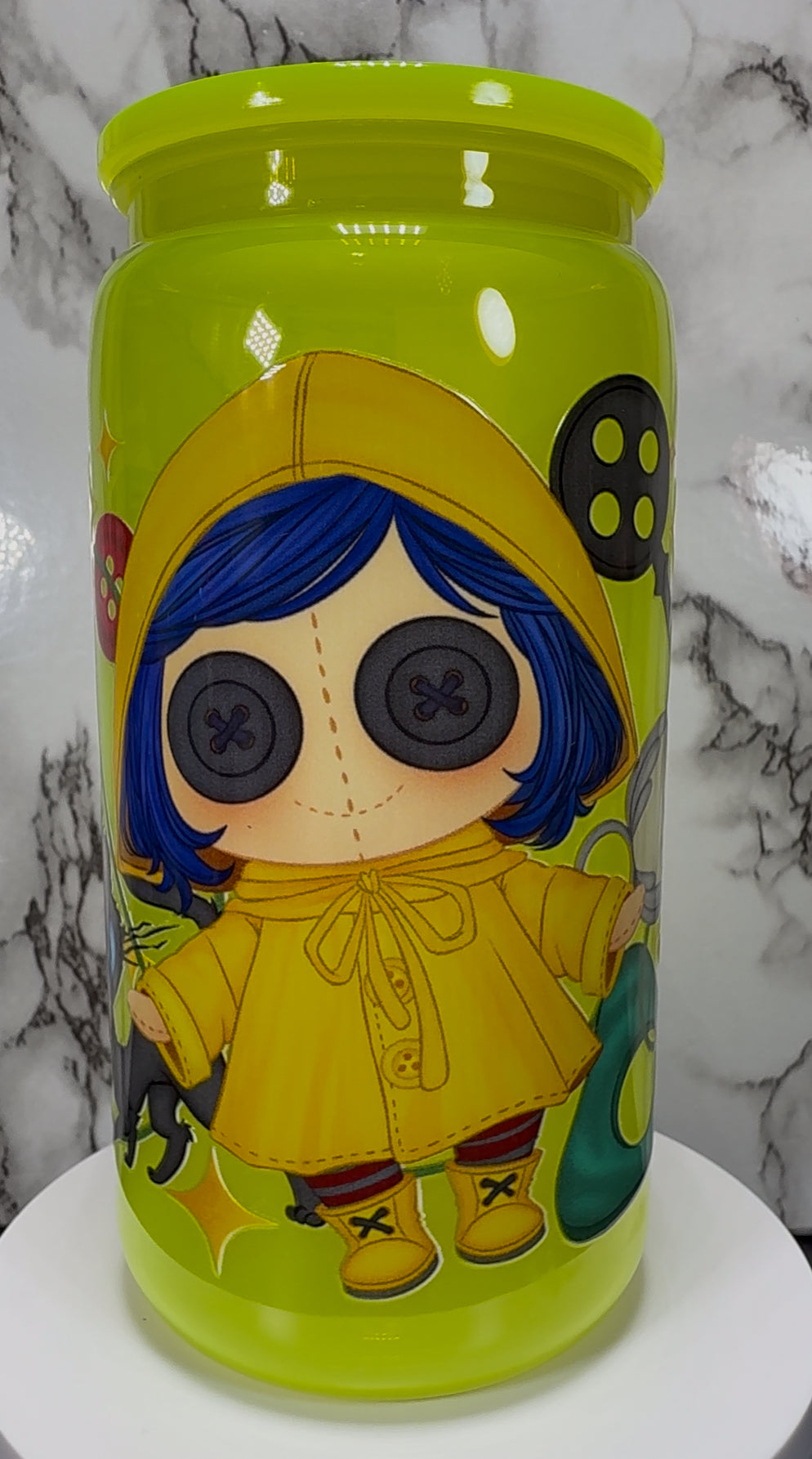 Little Coraline on a bright yellow PLASTIC beer can cup