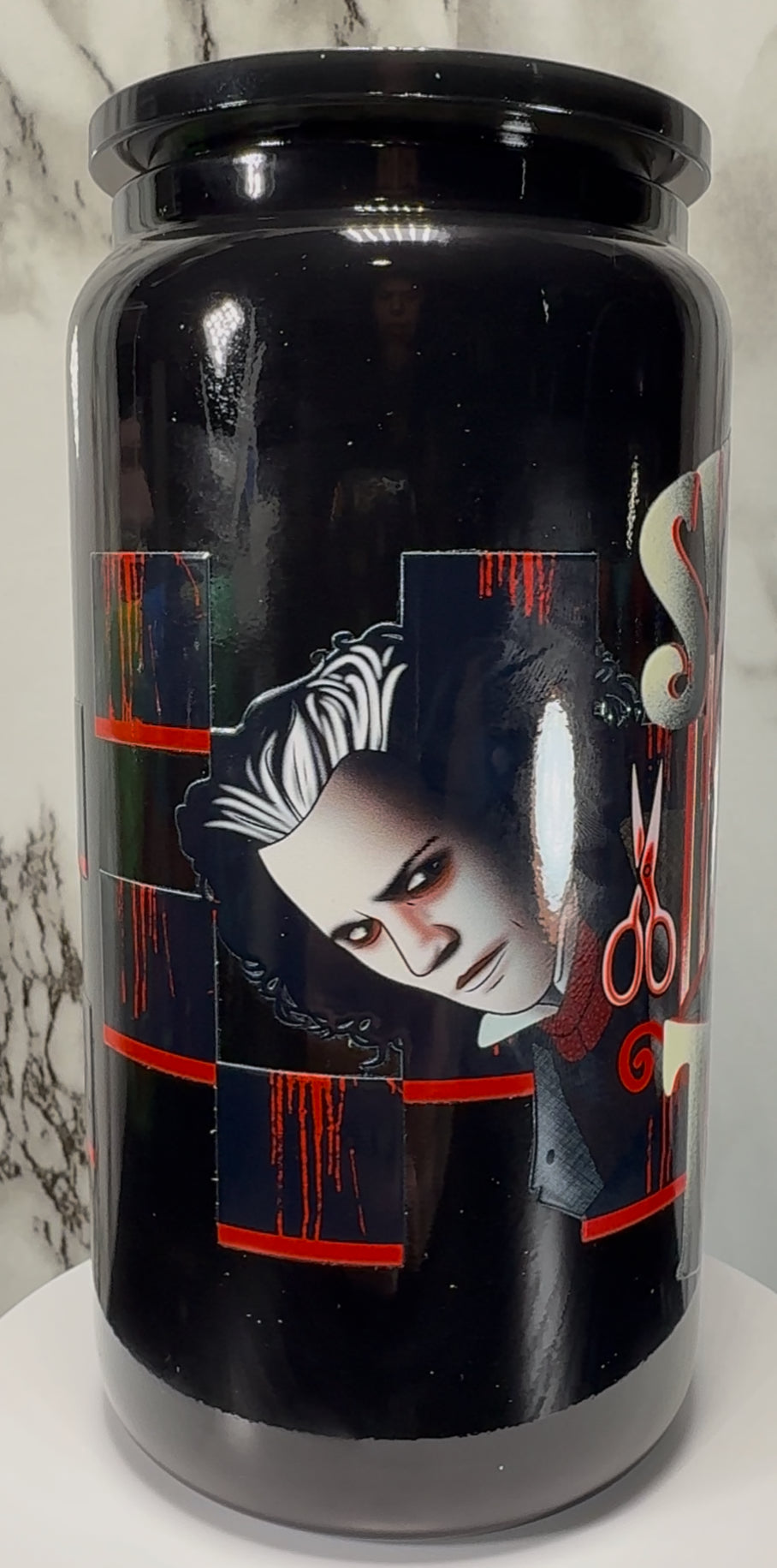 Sweeney Todd UVDTF on a black beer can glass