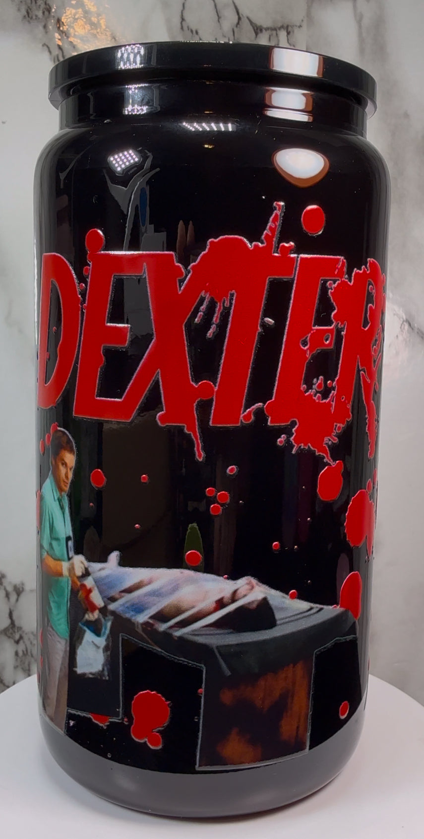 Dexter UVDTF on a black beer can glass