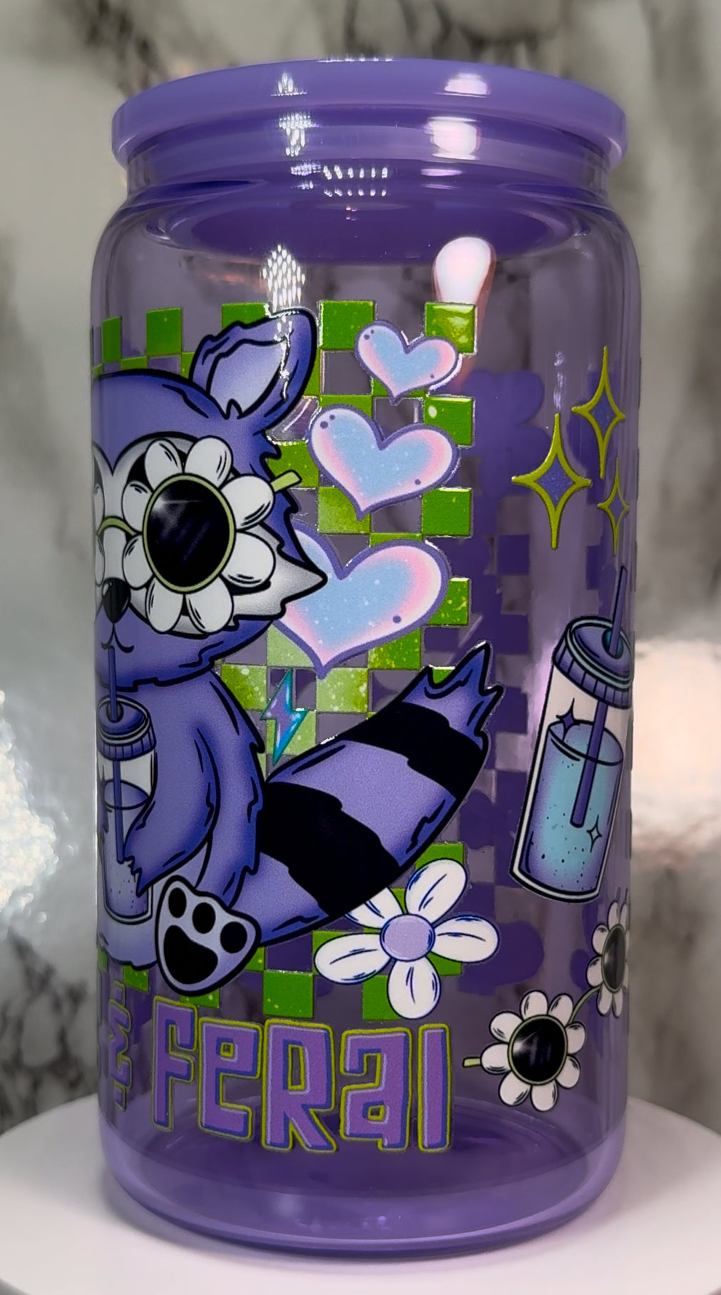 Cute & Feral Raccoon UVDTF on a purple beer can glass
