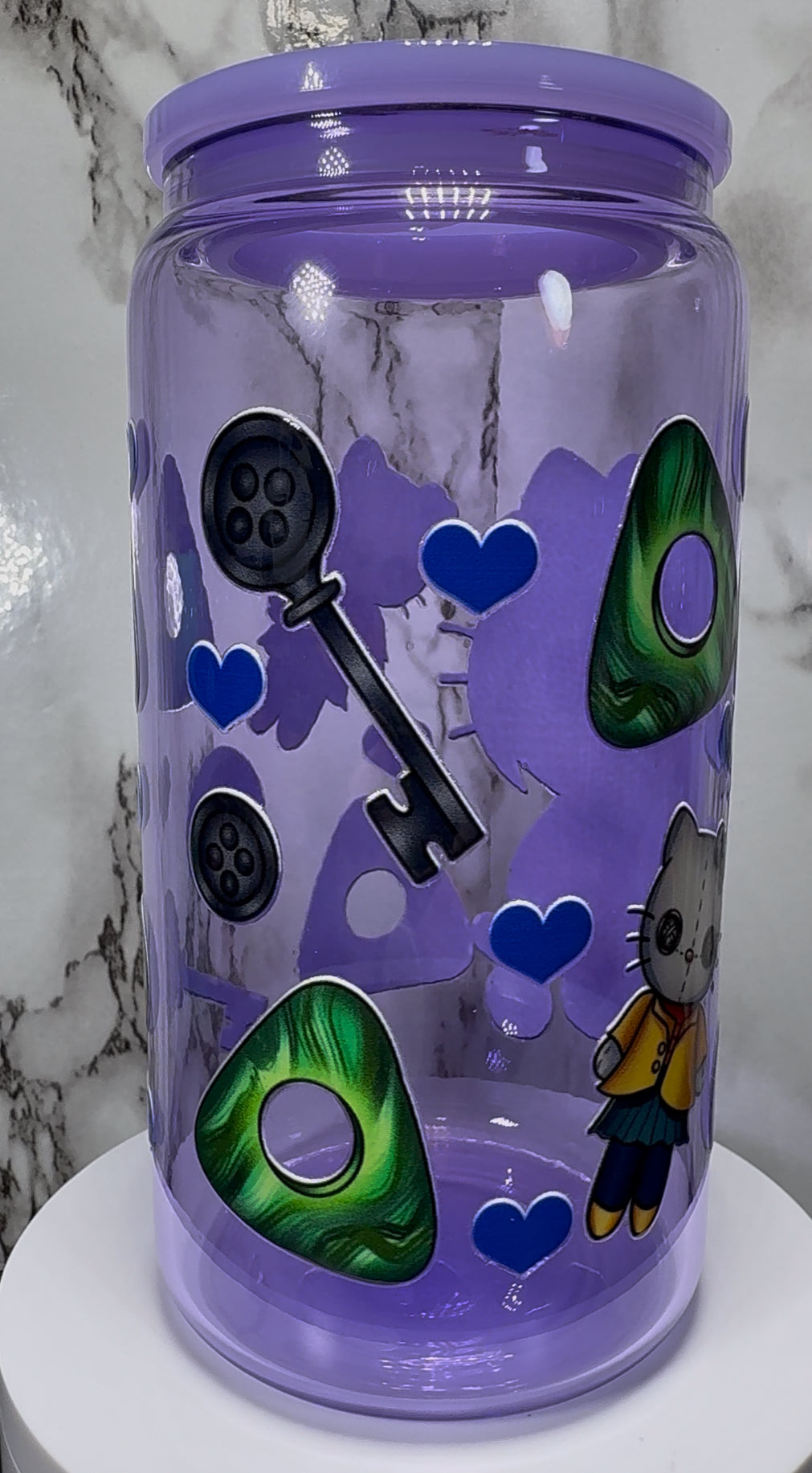 Coraline Hello Kitty UVDTF on a purple beer can glass