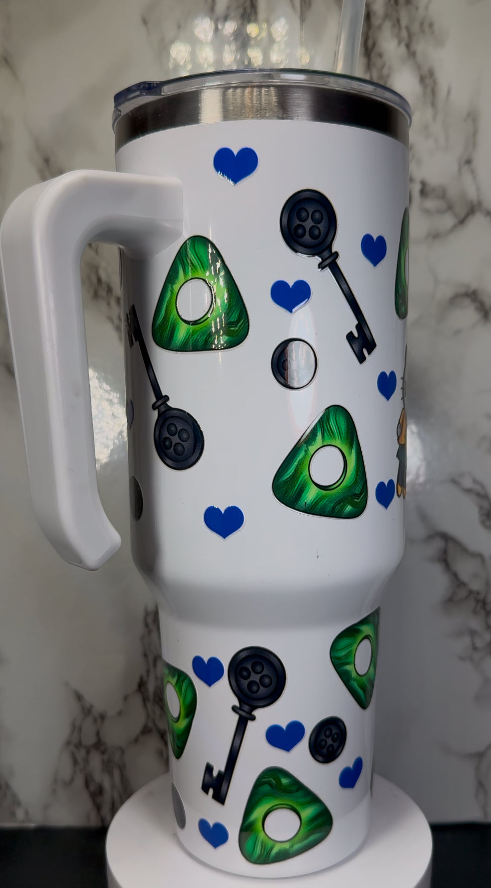 Hello Kitty Coraline UVDTF on a 40 oz white tumbler