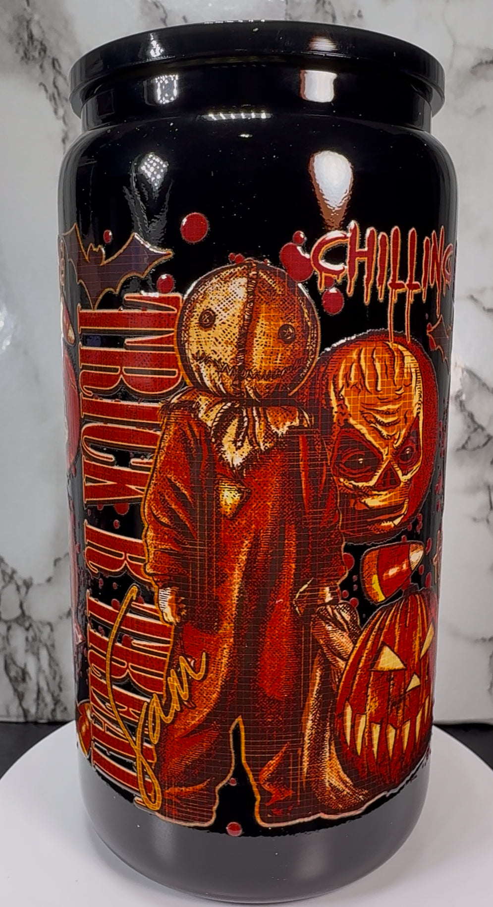 Trick R Treat Sam UVDTF on a black beer can glass