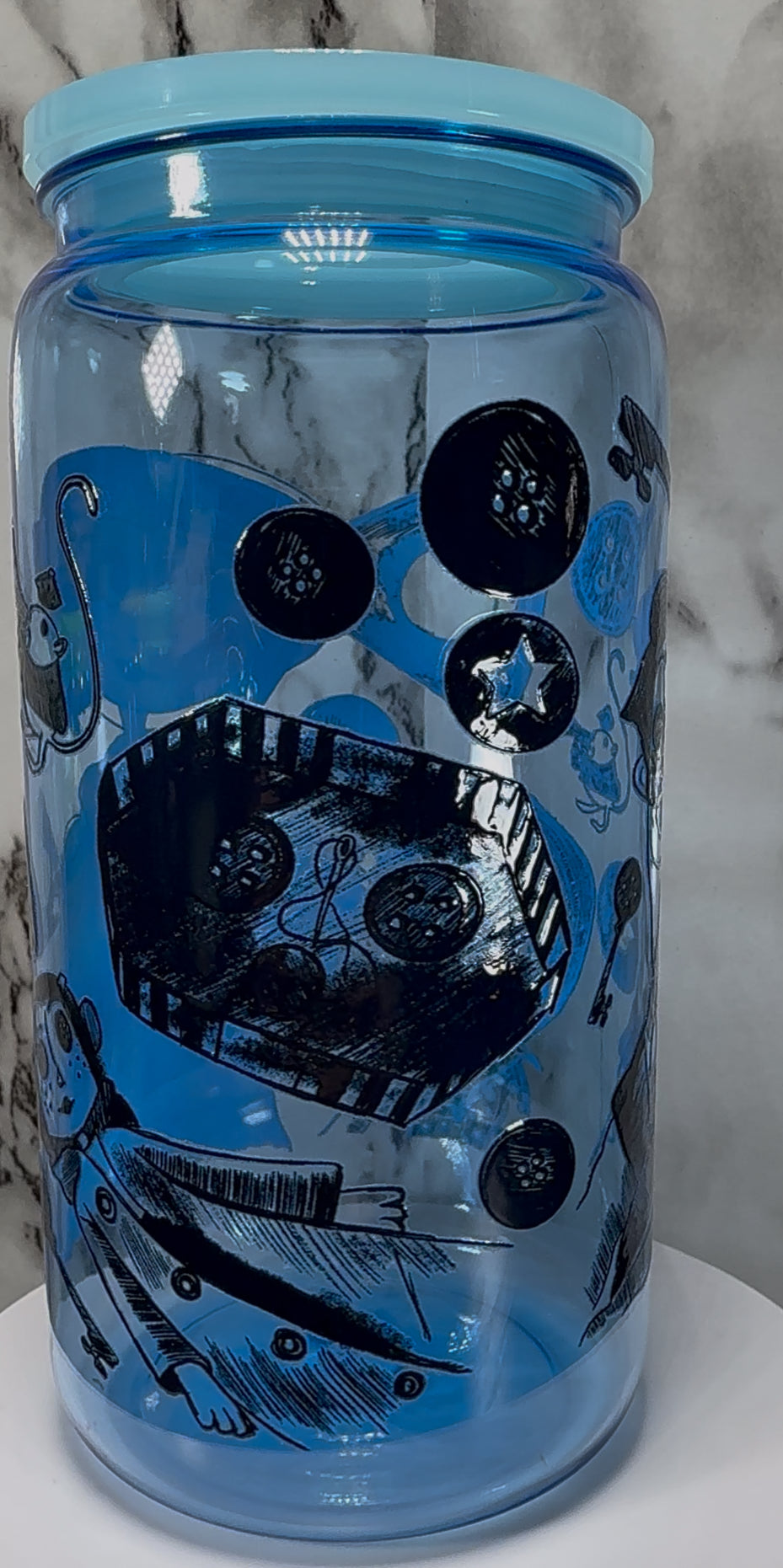 Coraline UVDTF on a blue PLASTIC beer can cup