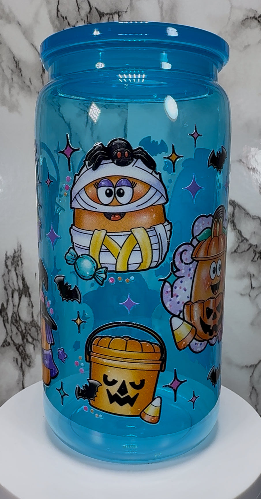 Old skool McDonald’s Halloween chicken nuggets and pail buckets UVDTF on a bright blue PLASTIC beer can cup