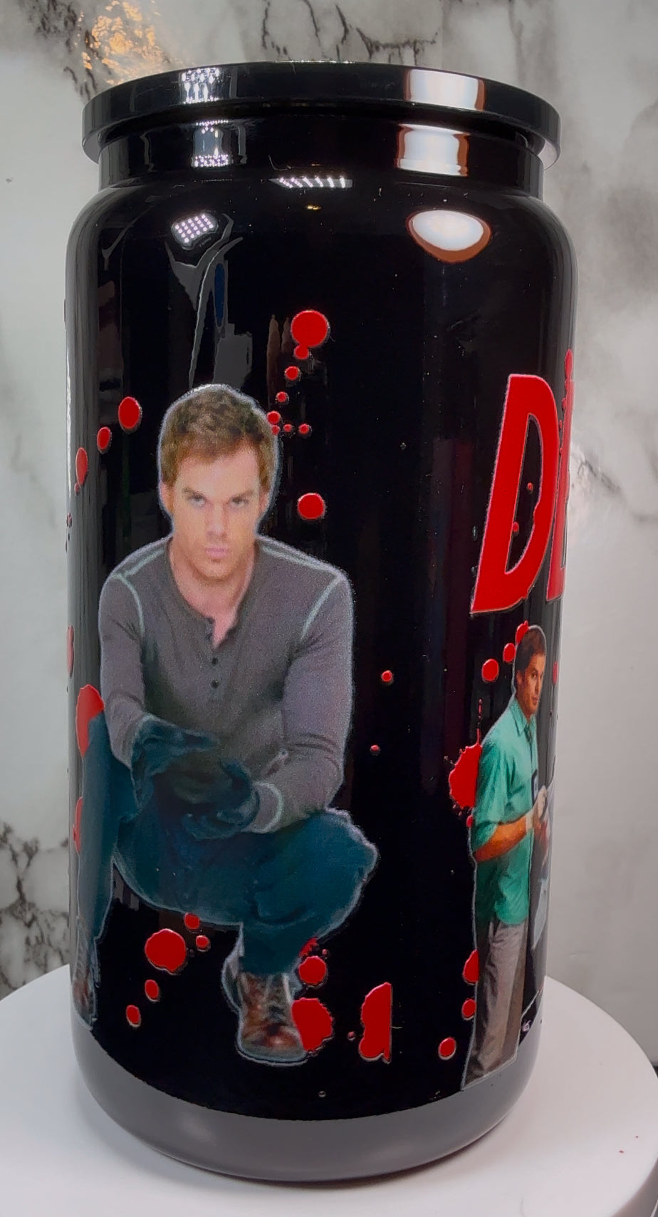 Dexter UVDTF on a black beer can glass