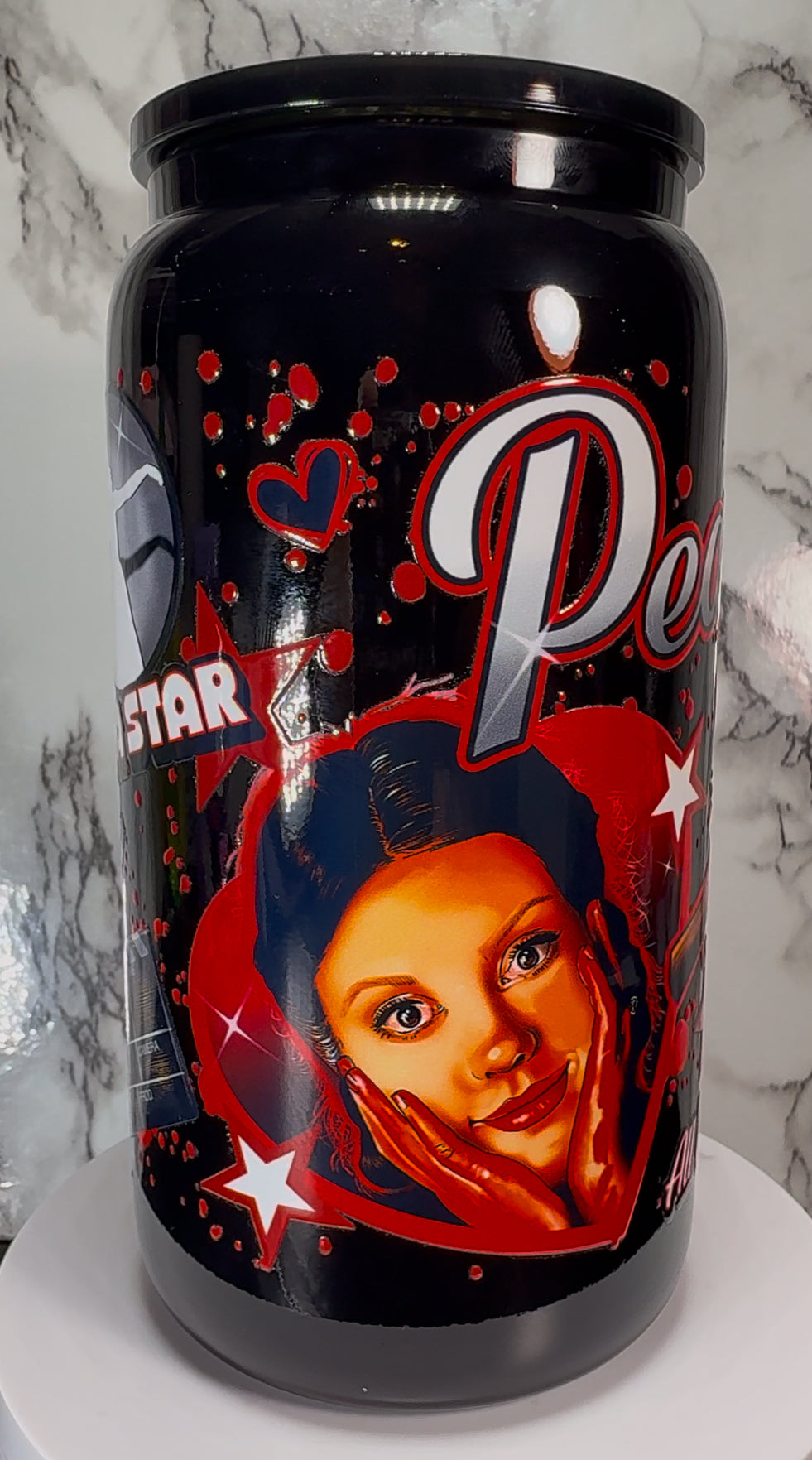 Pearl UVDTF on a black beer can glass