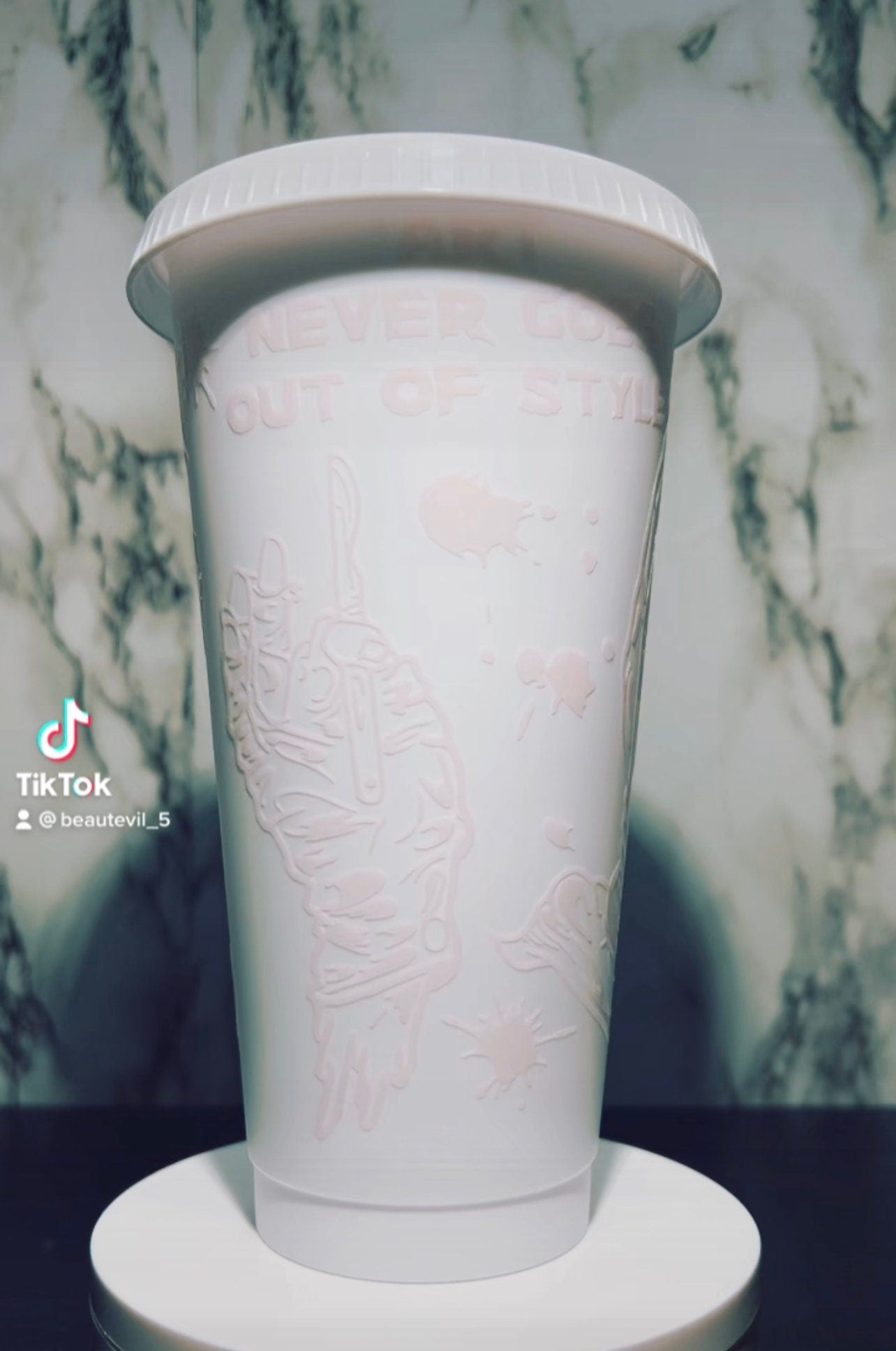 Art Clown color changing permanent vinyl on a white venti style cold cup.