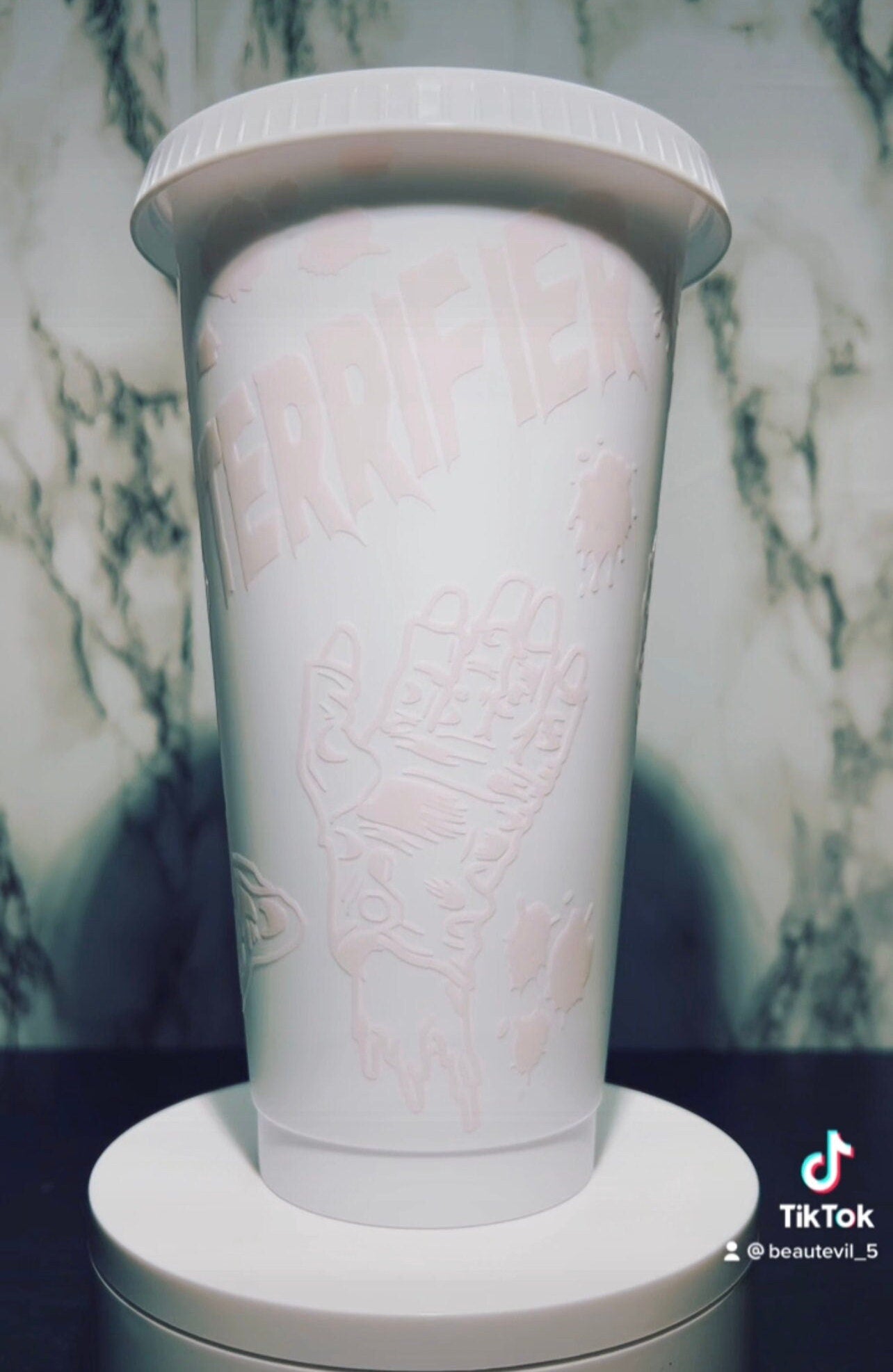 Art Clown color changing permanent vinyl on a white venti style cold cup.
