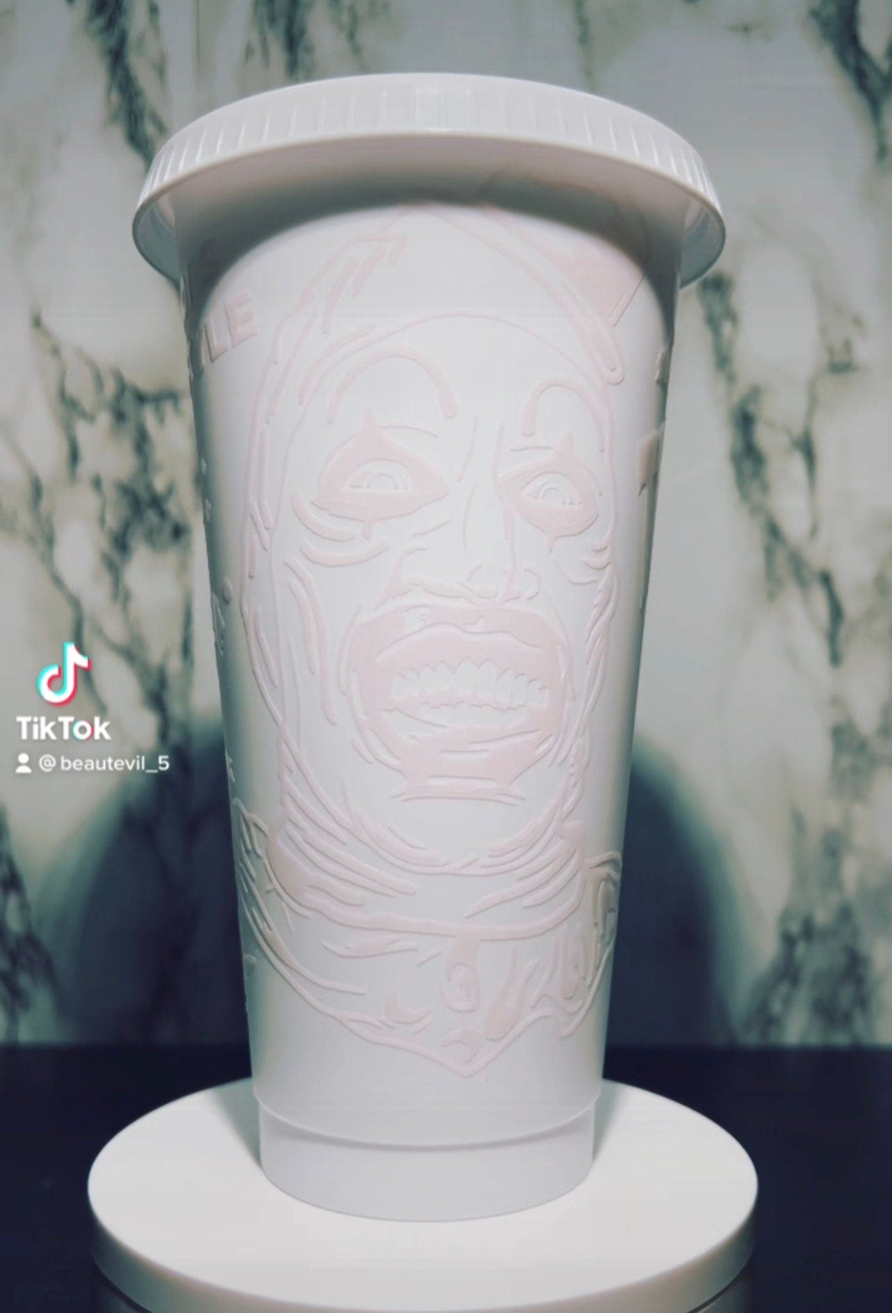Art Clown color changing permanent vinyl on a white venti style cold cup.