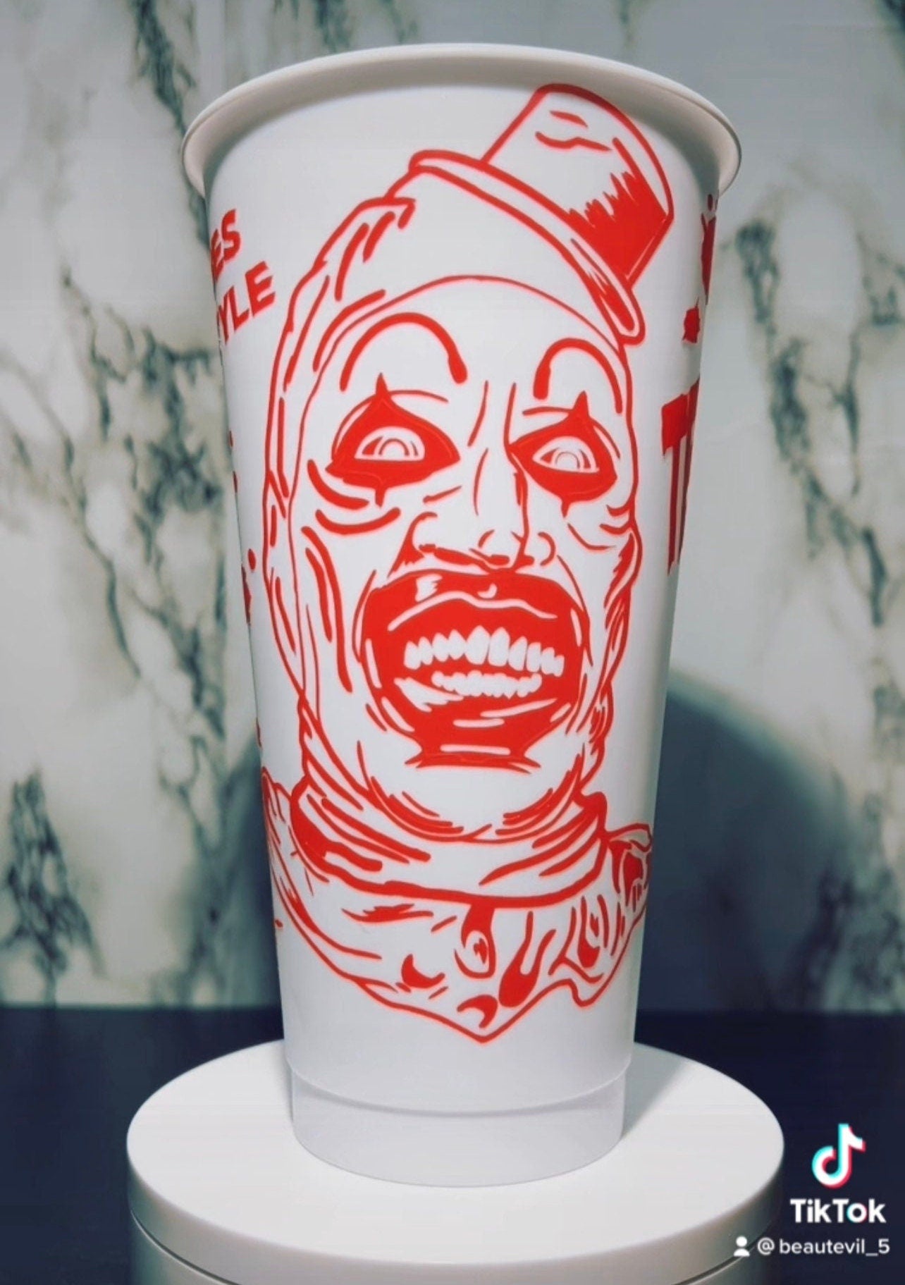 Art Clown color changing permanent vinyl on a white venti style cold cup.