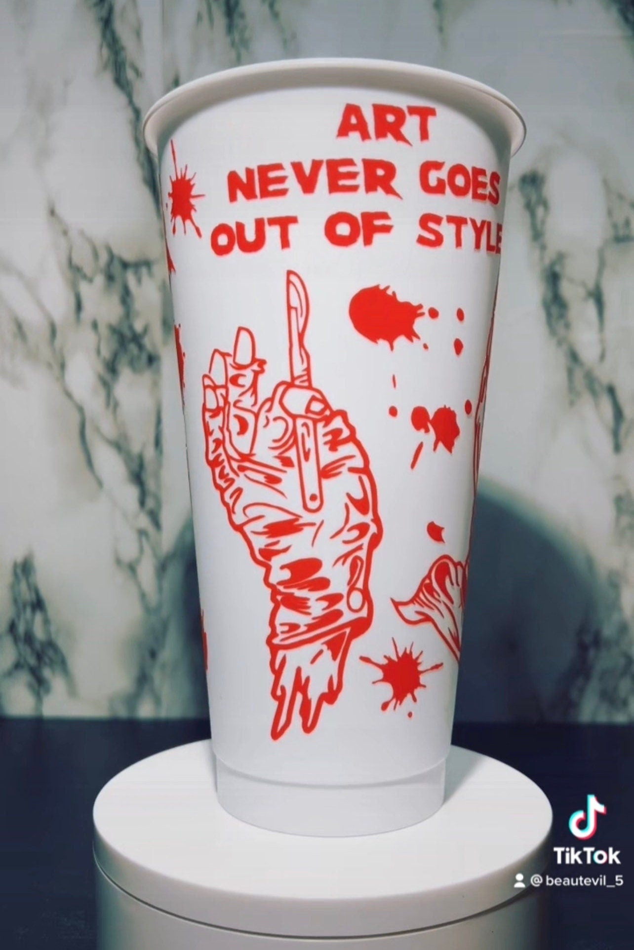 Art Clown color changing permanent vinyl on a white venti style cold cup.