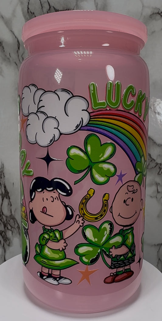 A Charlie Brown St. Patrick’s Day UVDTF on a pink PLASTIC beer can cup