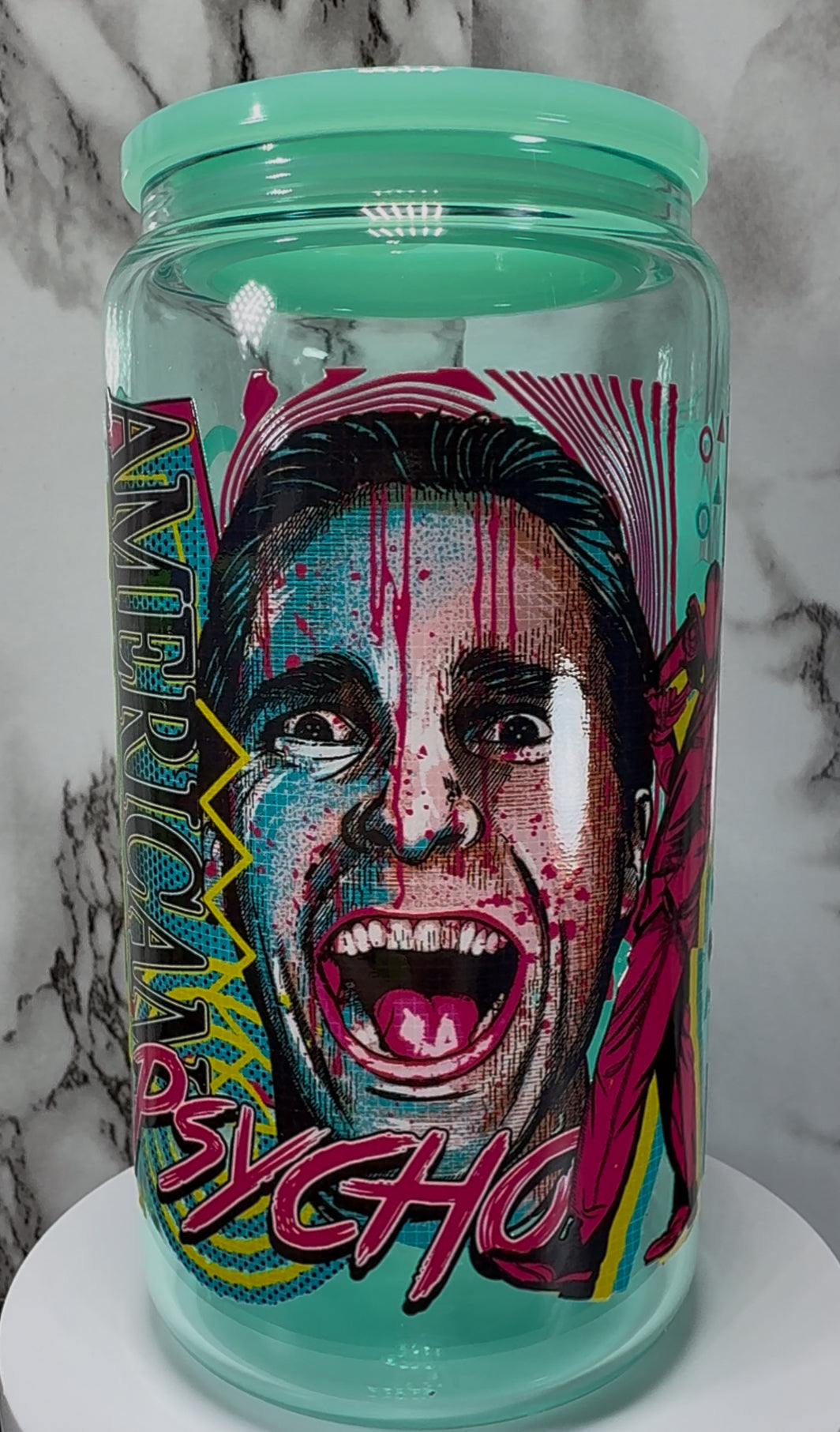 American Psycho Patrick Bateman UVDTF on a teal beer can glass
