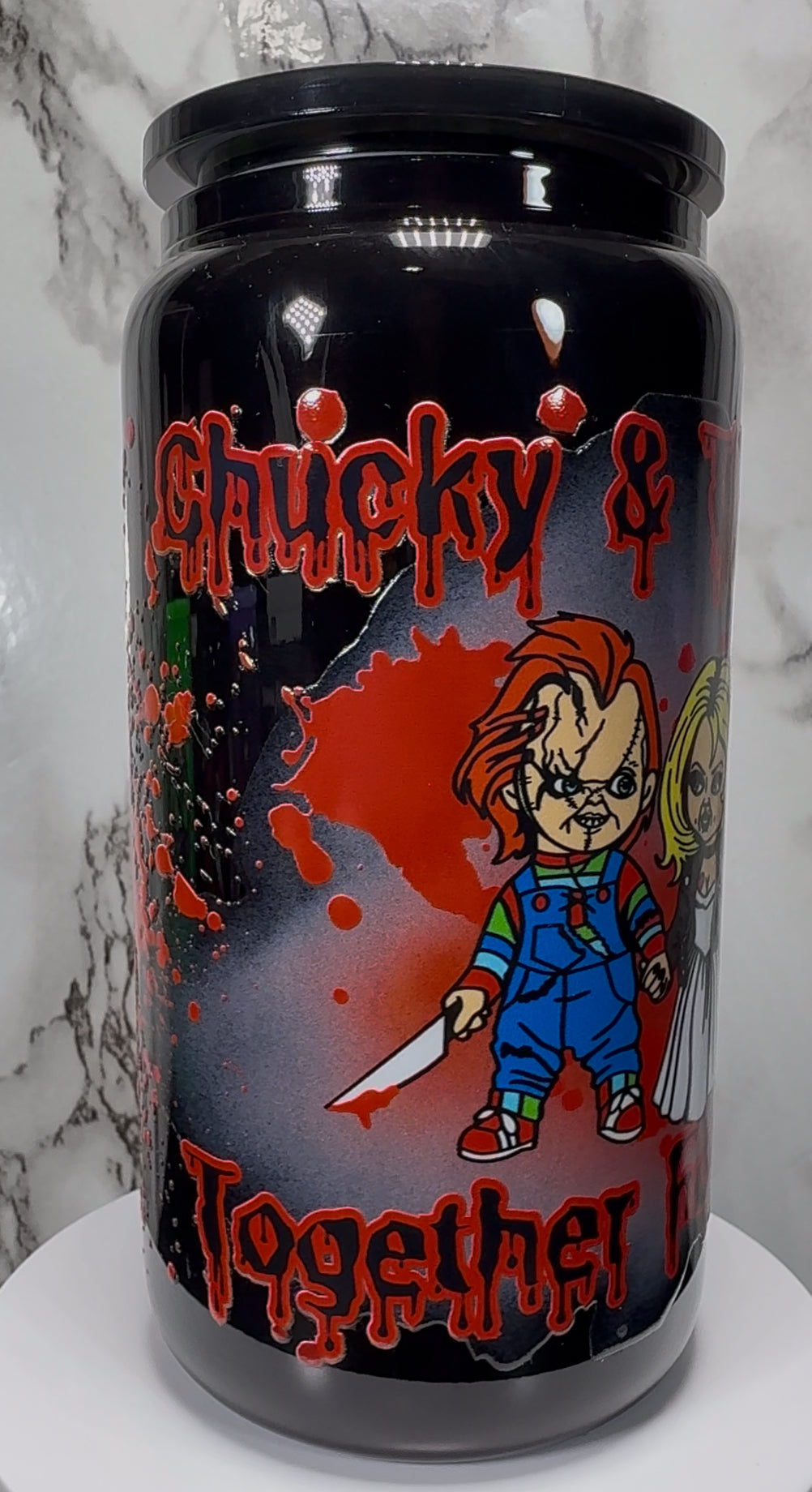 Chucky & Tiffany UVDTF on a black beer can glass