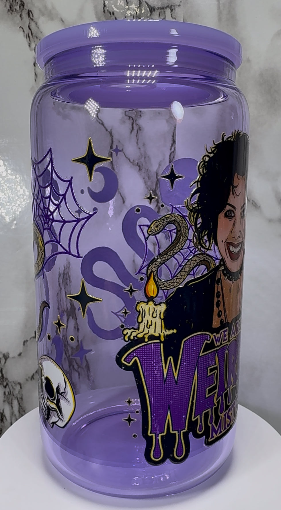 The Craft We Are The Weirdos UVDTF on a purple beer can glass