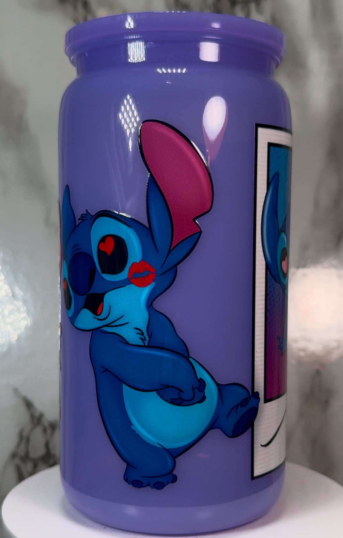 Stitch & Angel Polaroid UVDTF on a plastic purple beer can cup