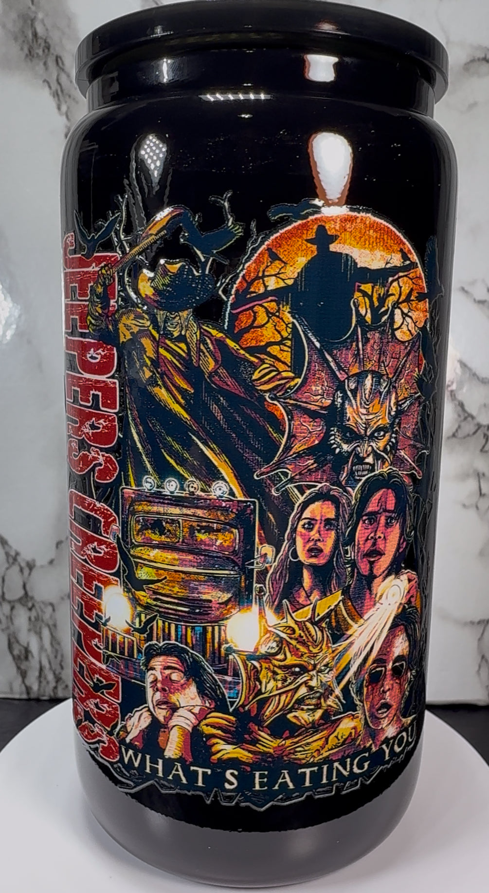 Jeepers Creepers UVDTF on a black beer can glass