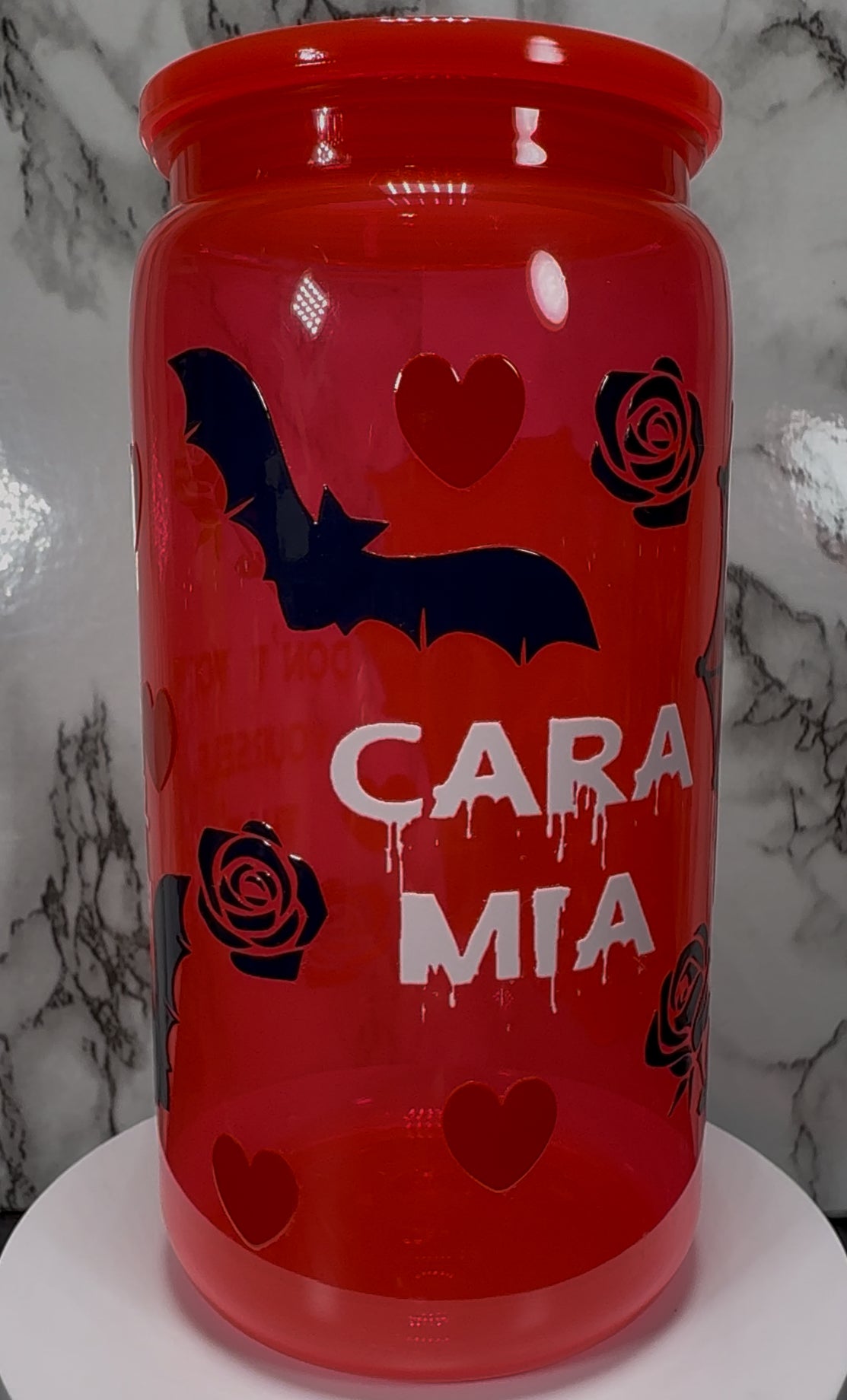 Gomez and Morticia Addams from Addams Family UVDTF on a bright red PLASTIC beer cancup