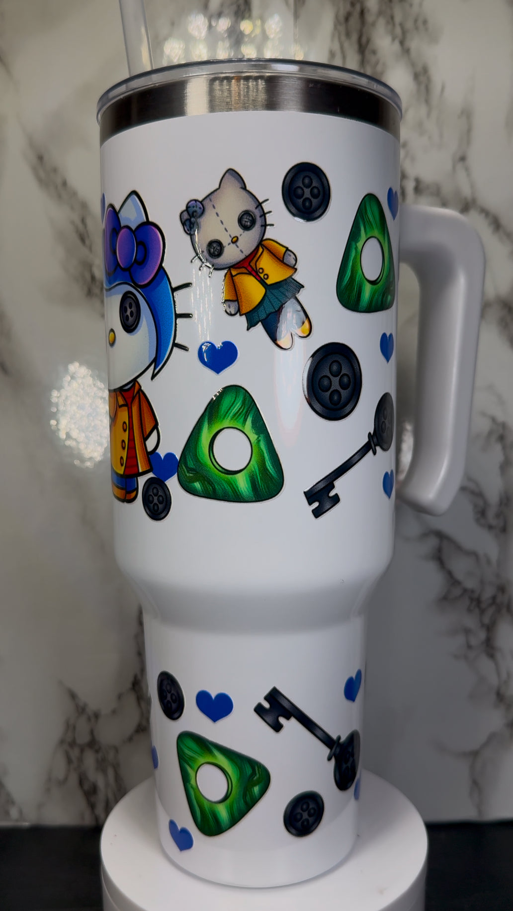 Hello Kitty Coraline UVDTF on a 40 oz white tumbler