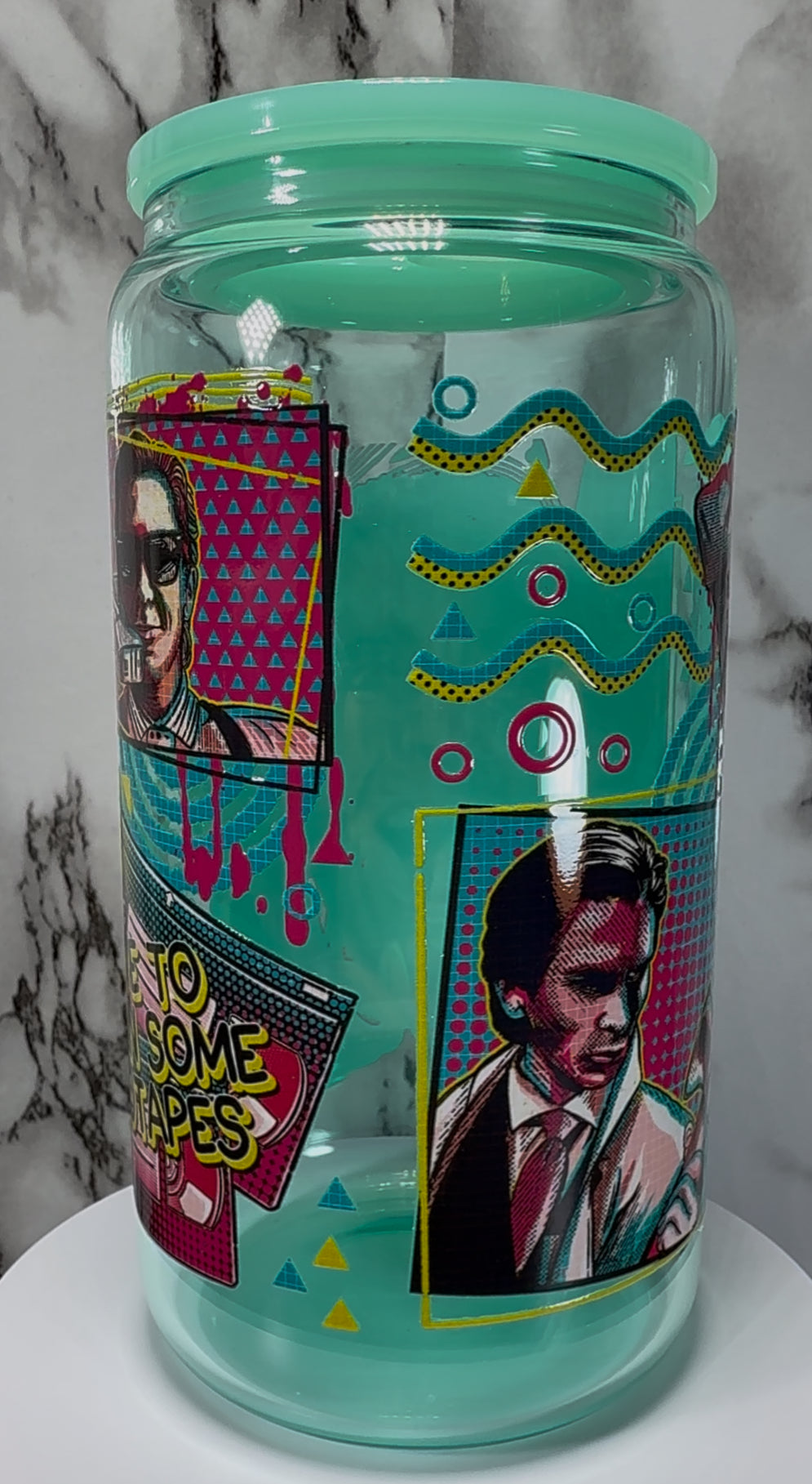 American Psycho Patrick Bateman UVDTF on a teal beer can glass